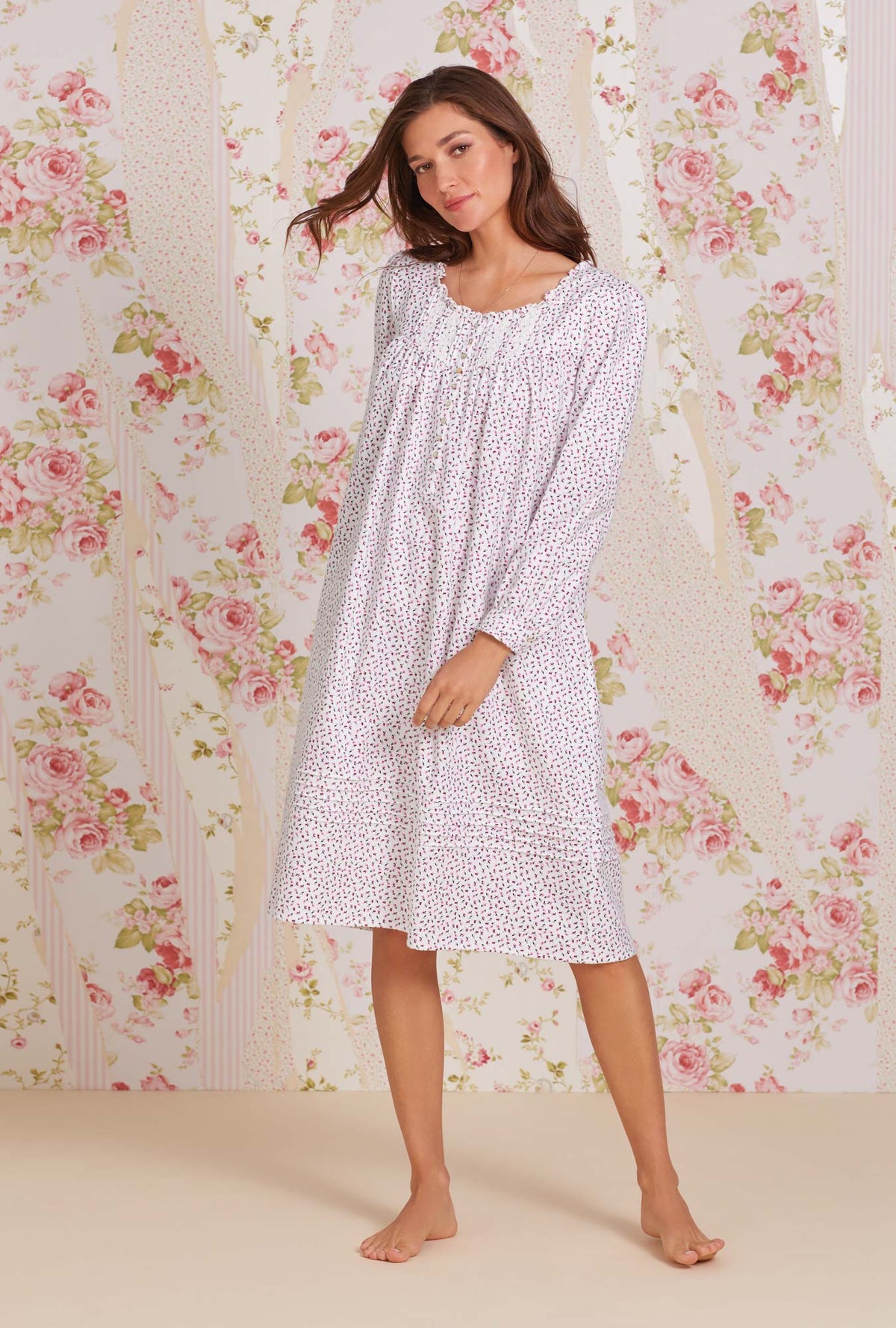A lady wearing white long sleeve cotton flannel waltz nightgown with joyful berry print.