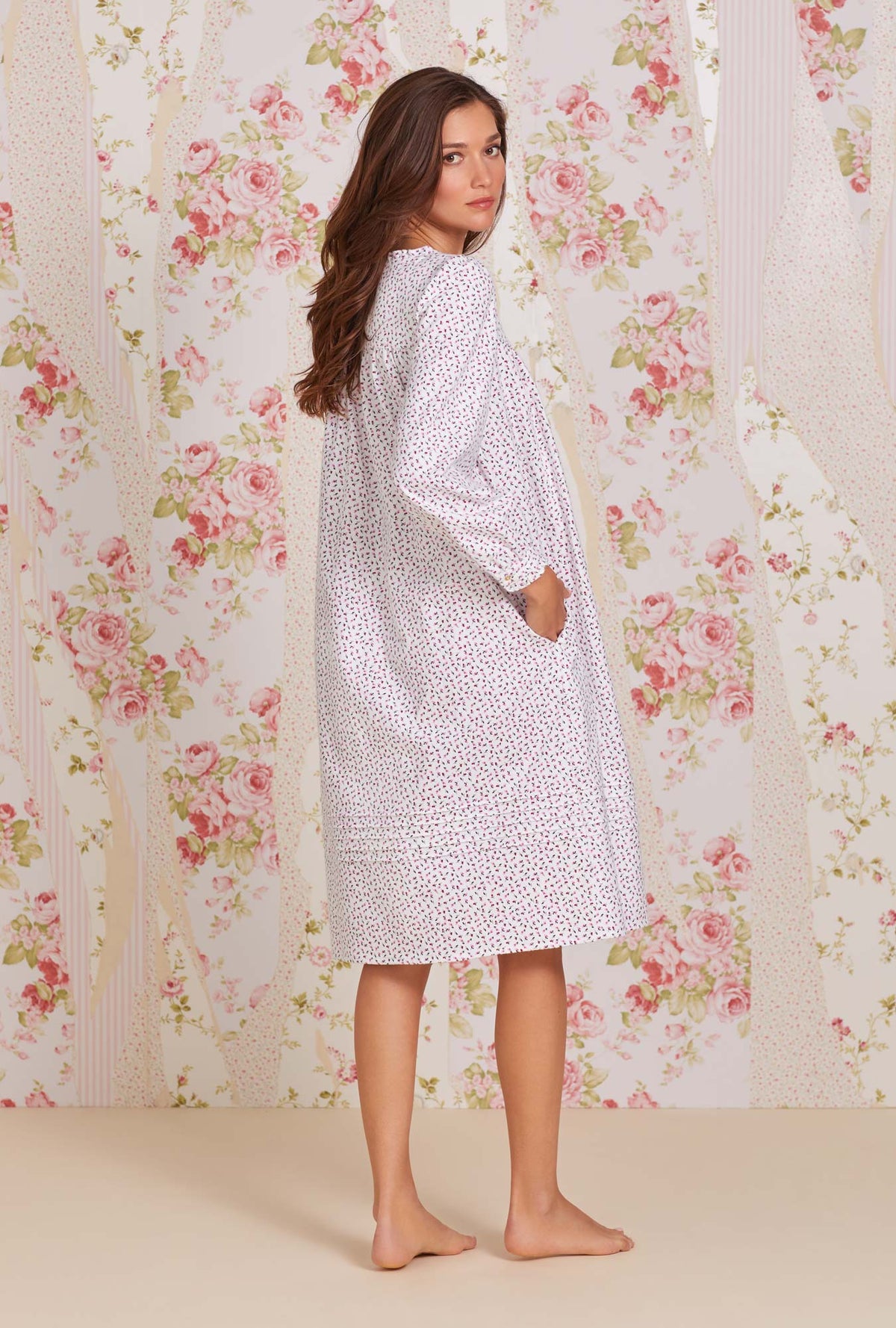 A lady wearing white long sleeve cotton flannel waltz nightgown with joyful berry print.