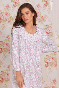 A lady wearing white long sleeve cotton flannel waltz nightgown with joyful berry print.