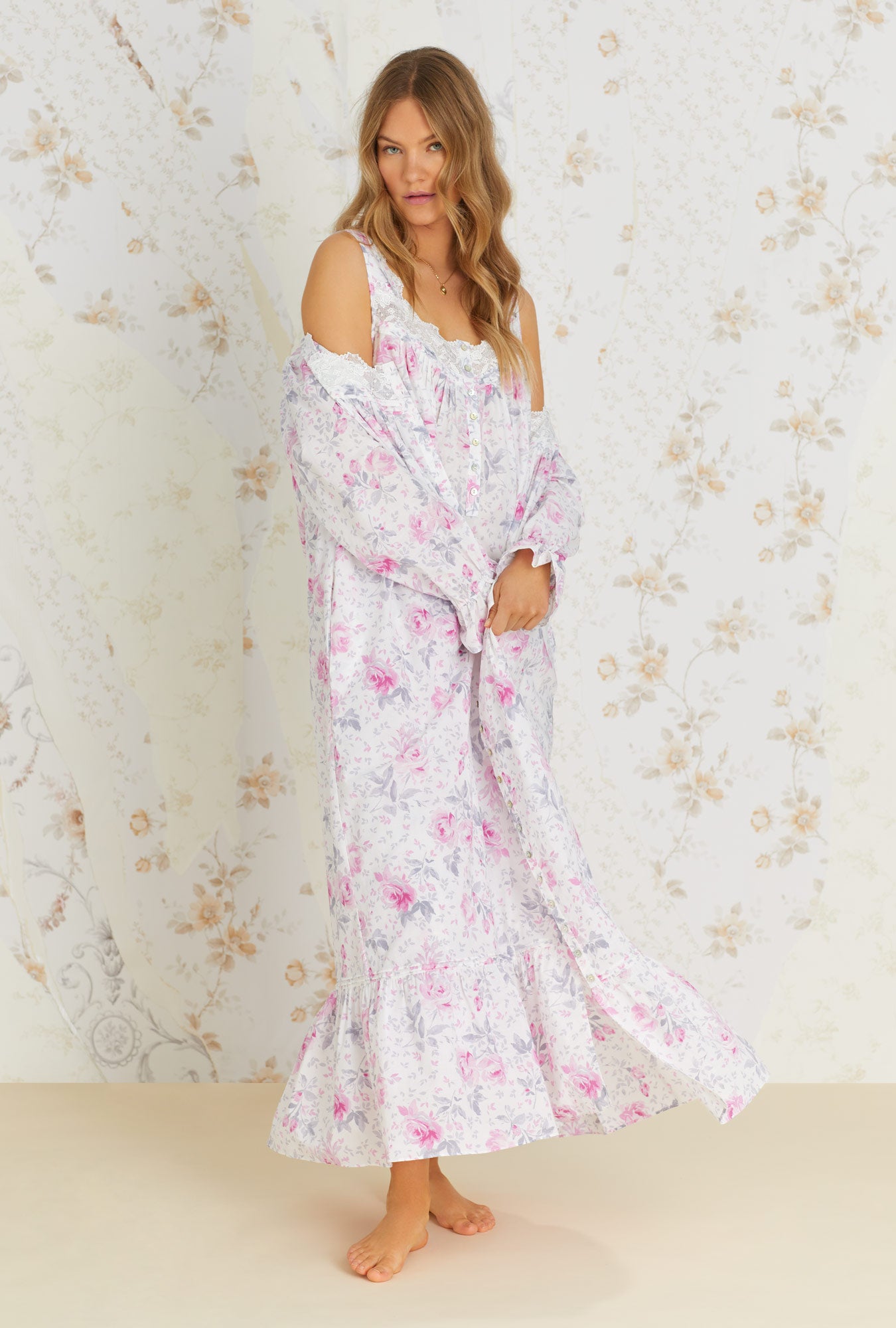 A lady wearing white sleeveless cotton nightgown with mendocino rose print.