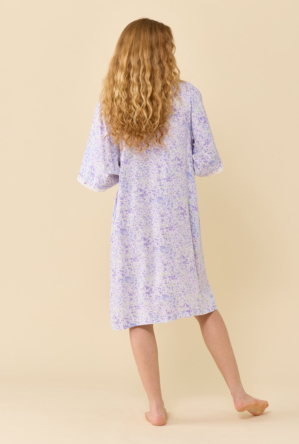 A lady wearing Lavender Whisper Caftan back view