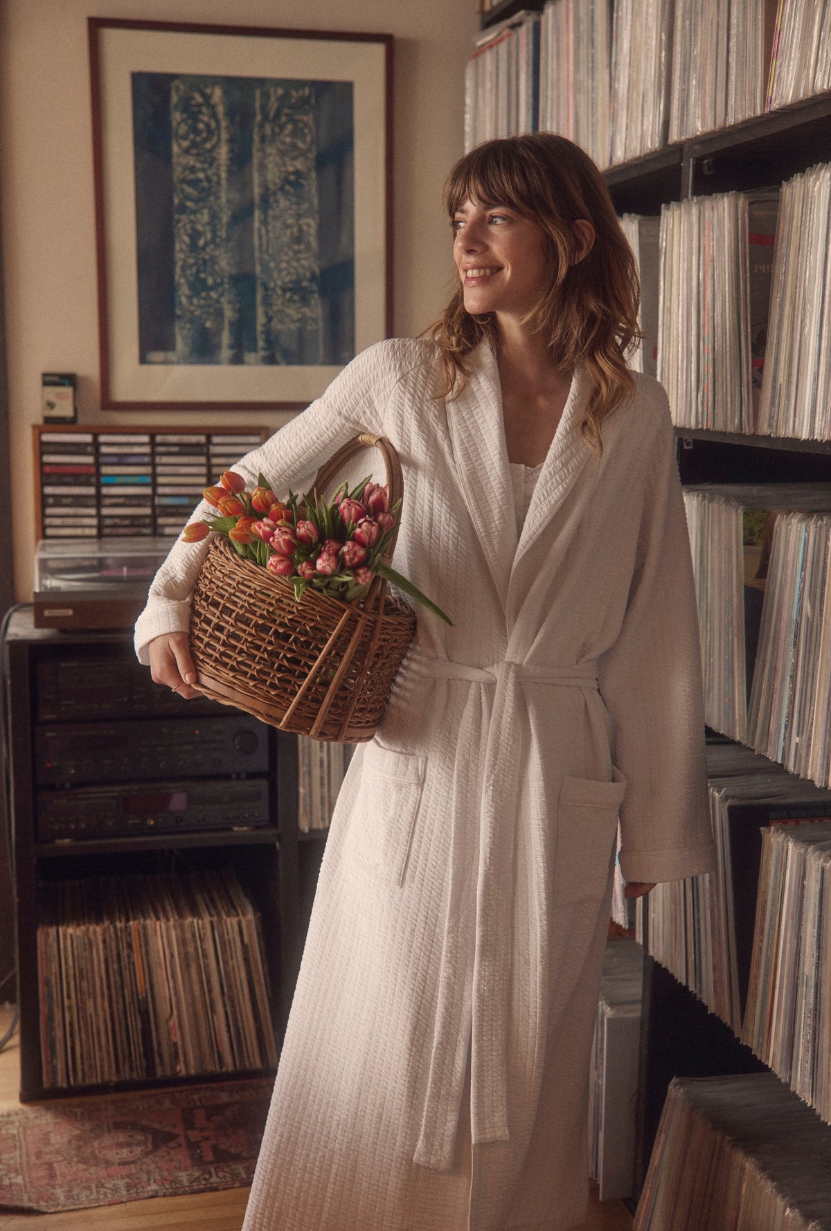 A lady wearing Iconic White Silky Cotton Waffle Knit Long Wrap Robe