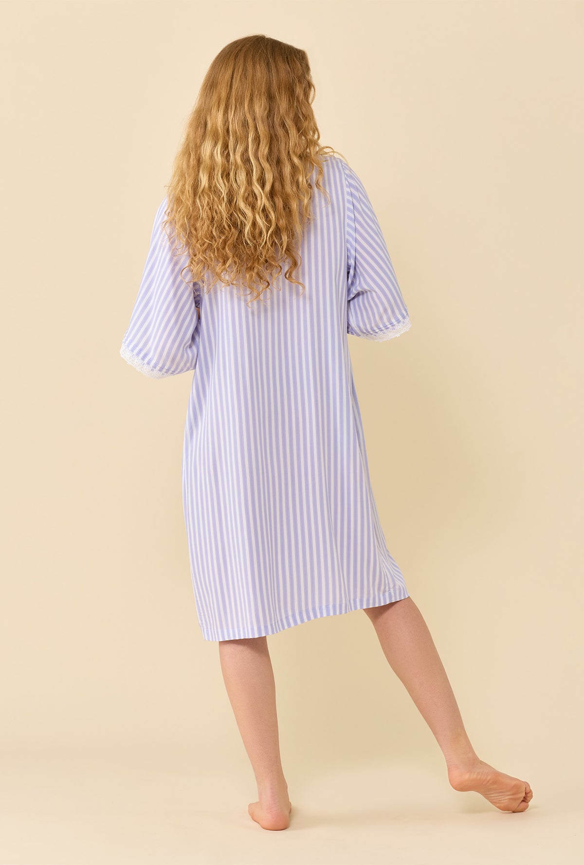 A lady wearing Provence Stripe Caftan back view