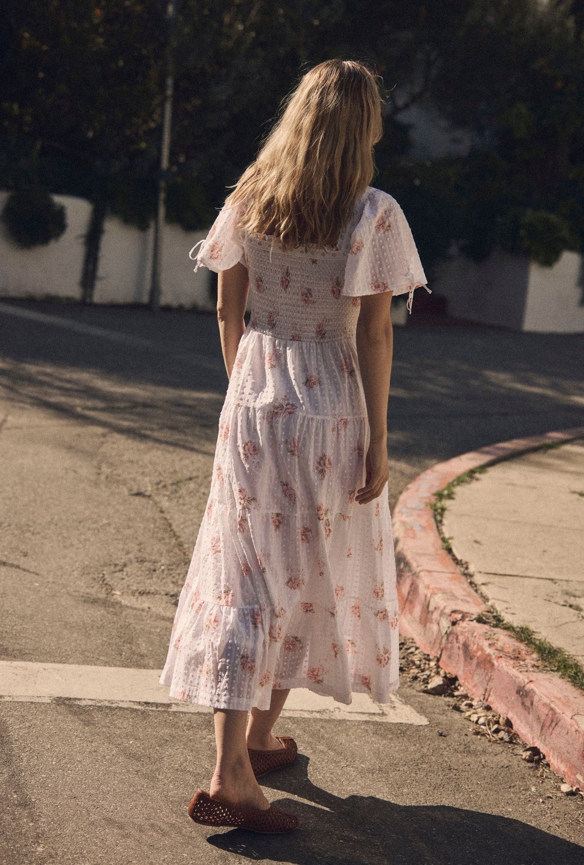 A lady wearing The "Rosalie" Venice Rose Cotton Swiss Dot Maxi Dress back view
