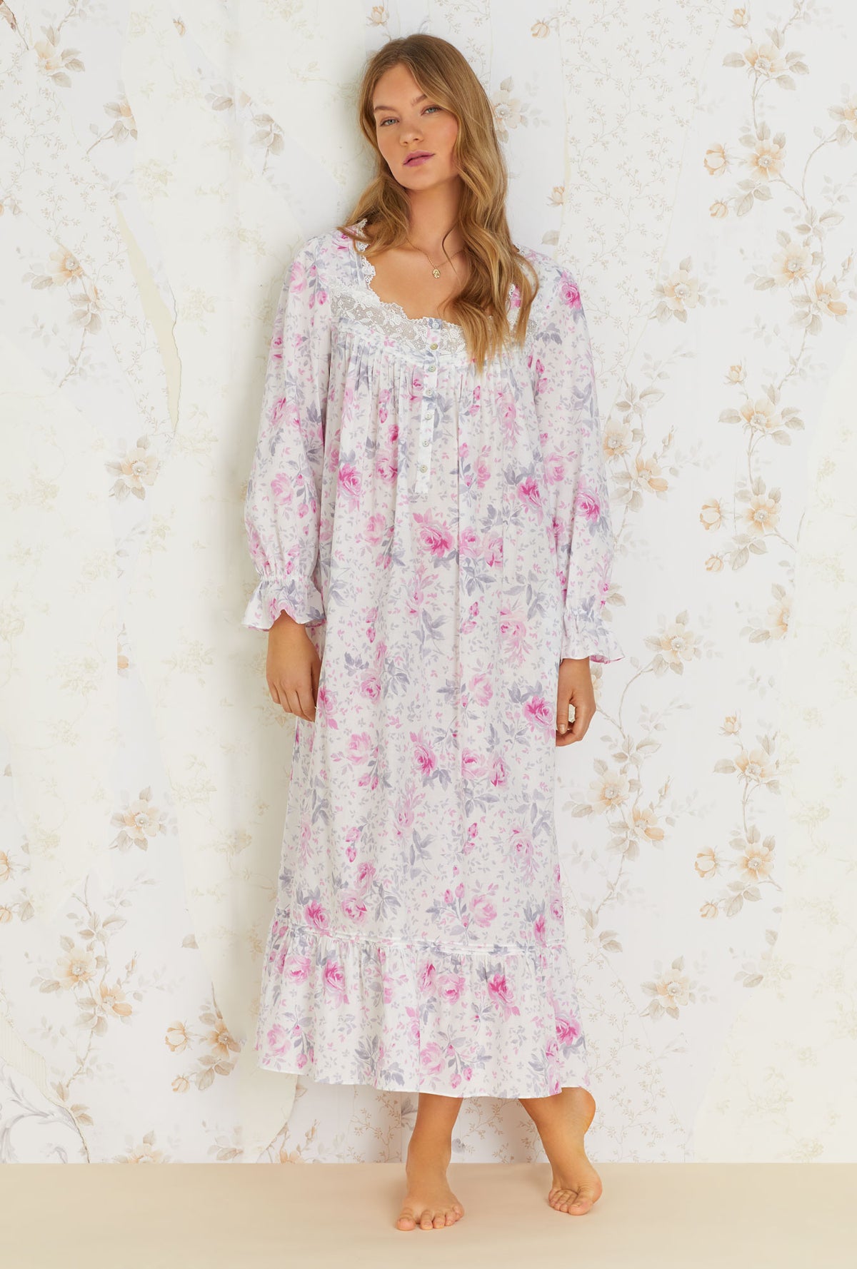 A lady wearing white long sleeve cotton nightgown with mendocino rose print.