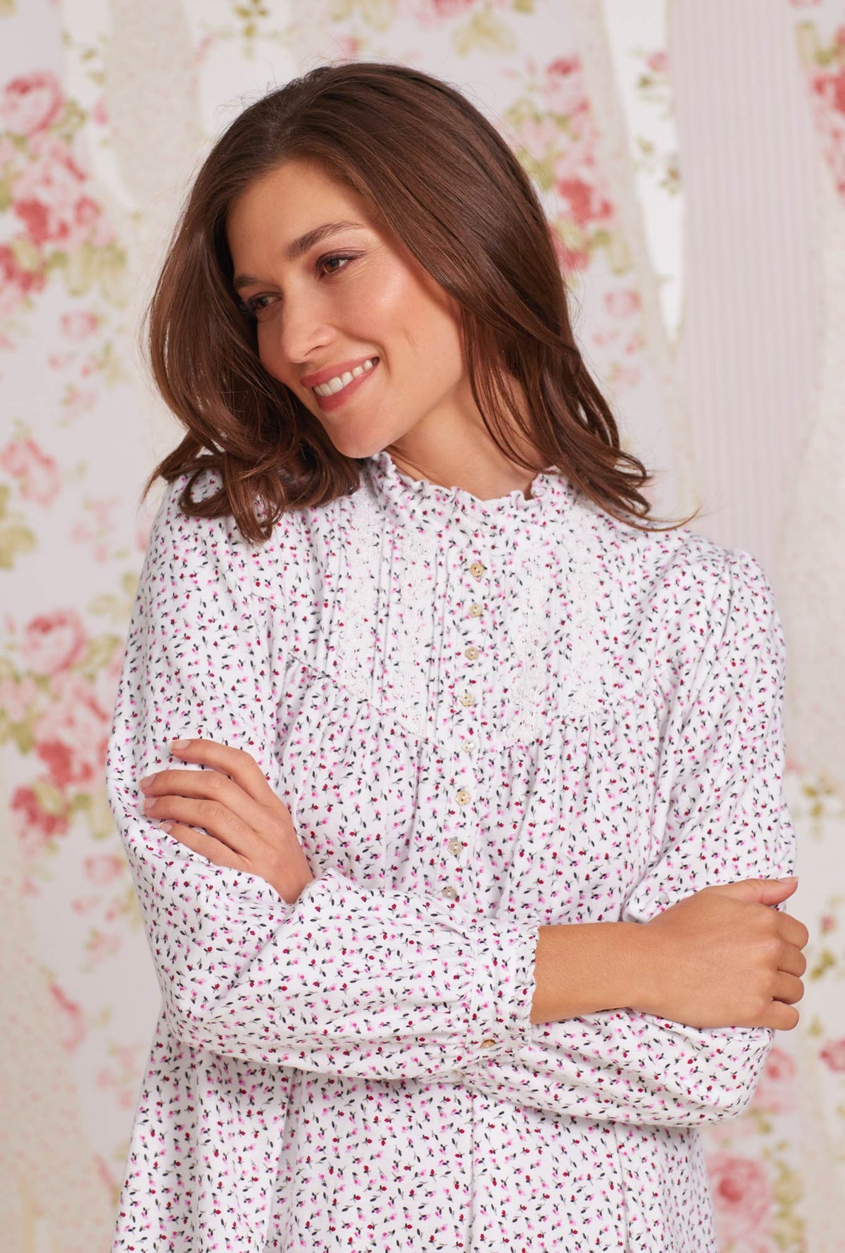 A lady wearing white long sleeve cotton flannel madeline highneck nightgown with joyful berry print.