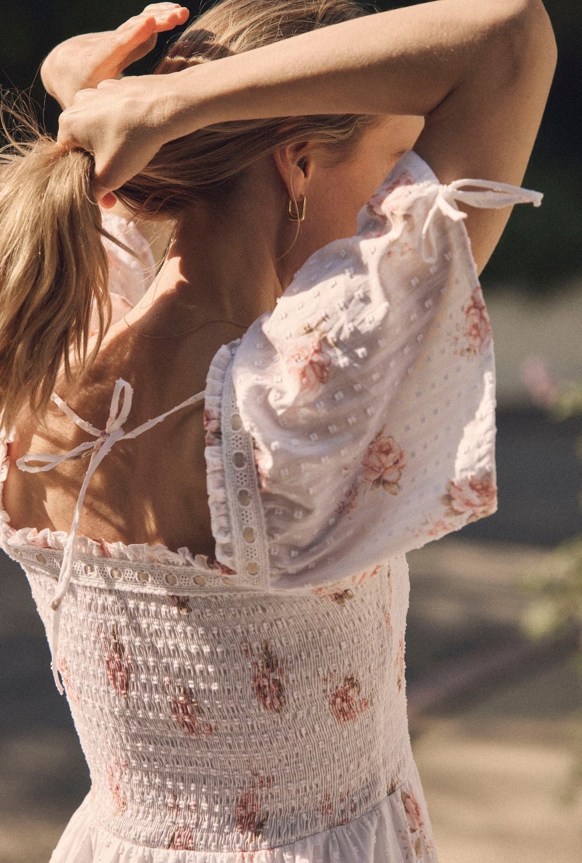 A lady wearing The "Rosalie" Venice Rose Cotton Swiss Dot Maxi Dress closer back view
