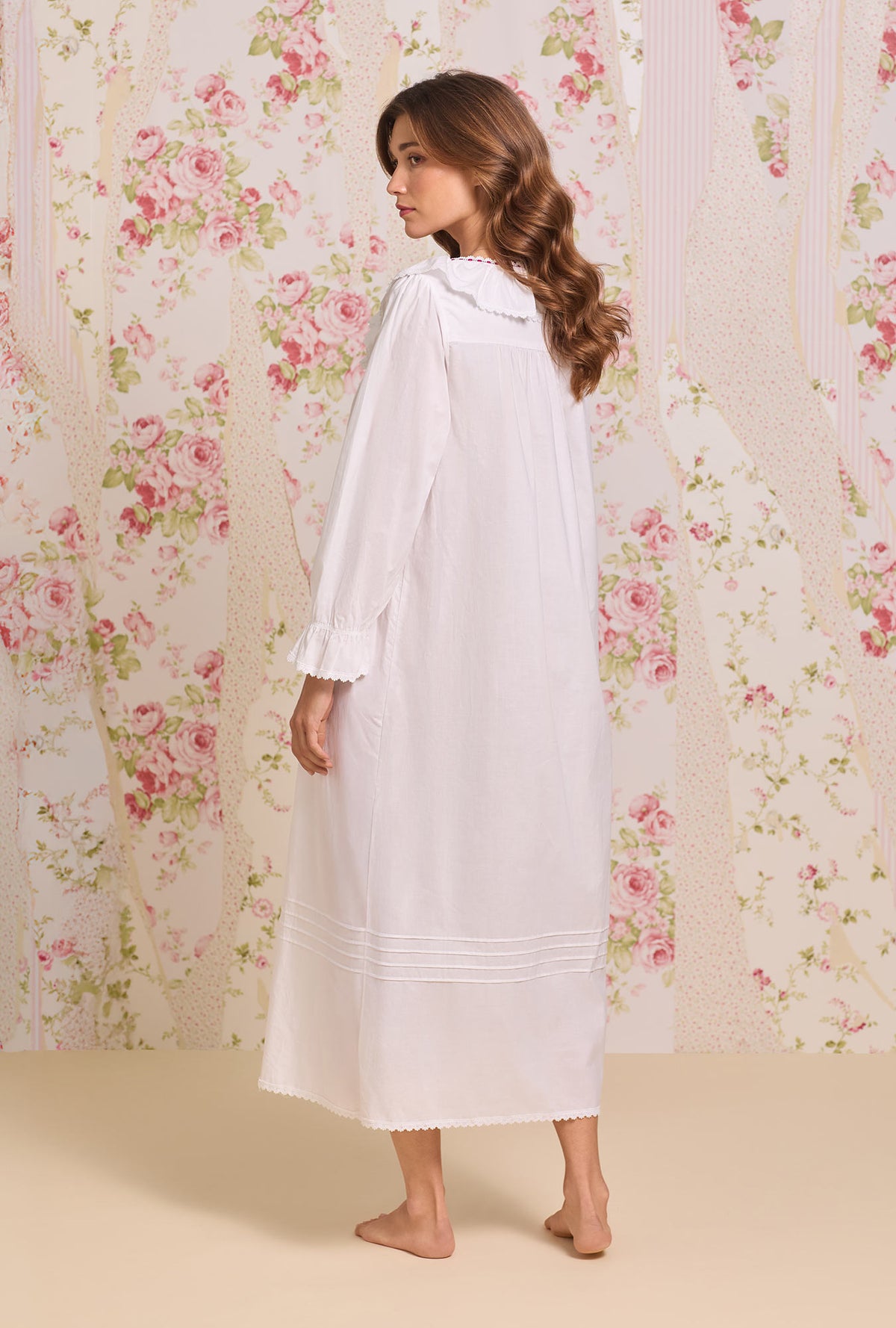 A lady wearing The "Clara" Iconic White Cotton Lawn Nightdress