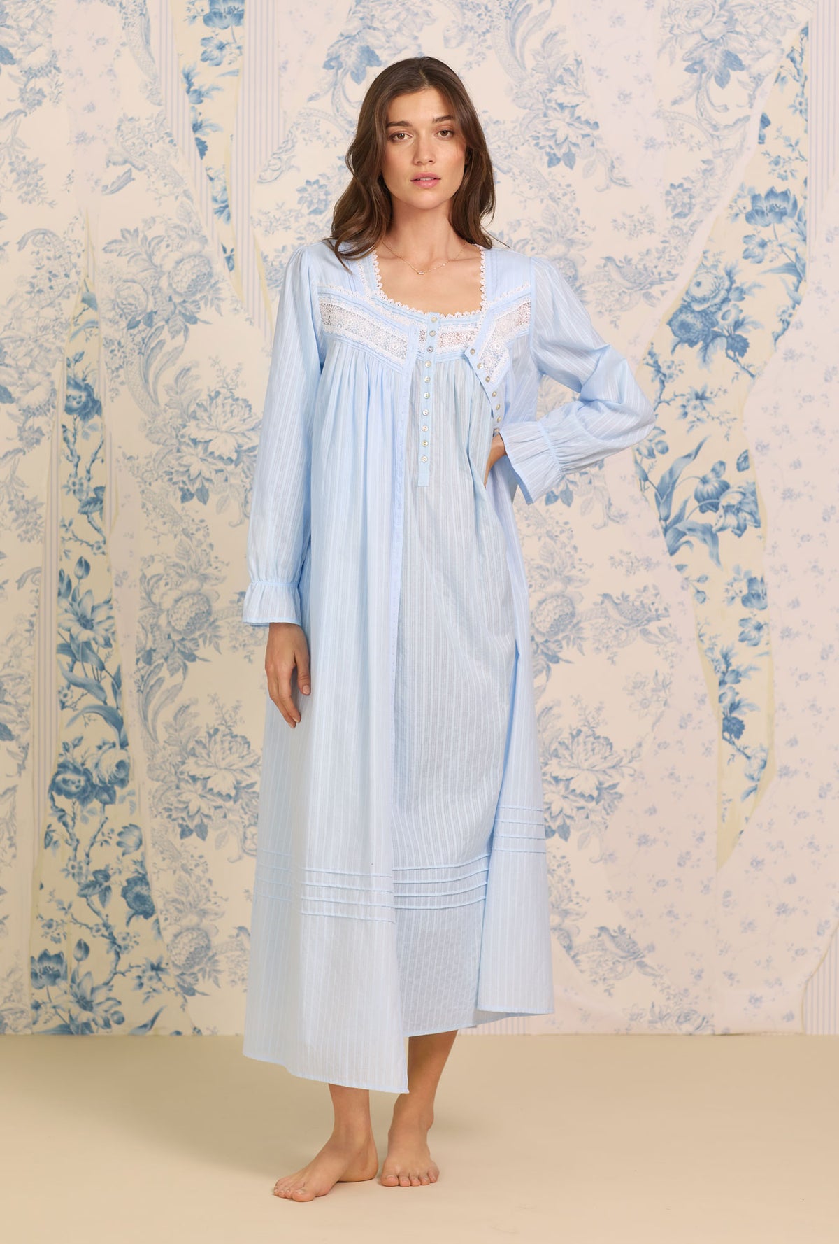 A lady wearing Dobby Stripe Blue Gown
