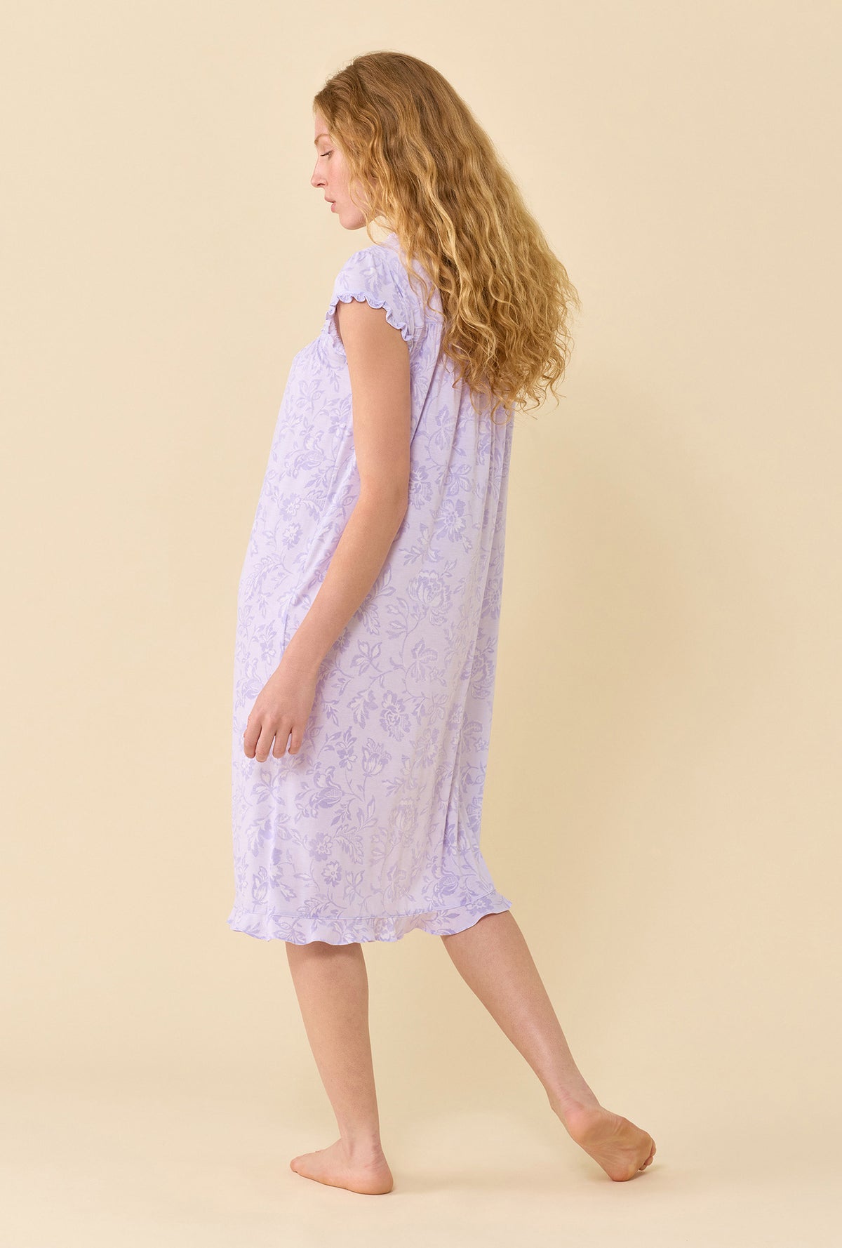 A lady wearing Lavender Bloom Waltz Nightgown back view