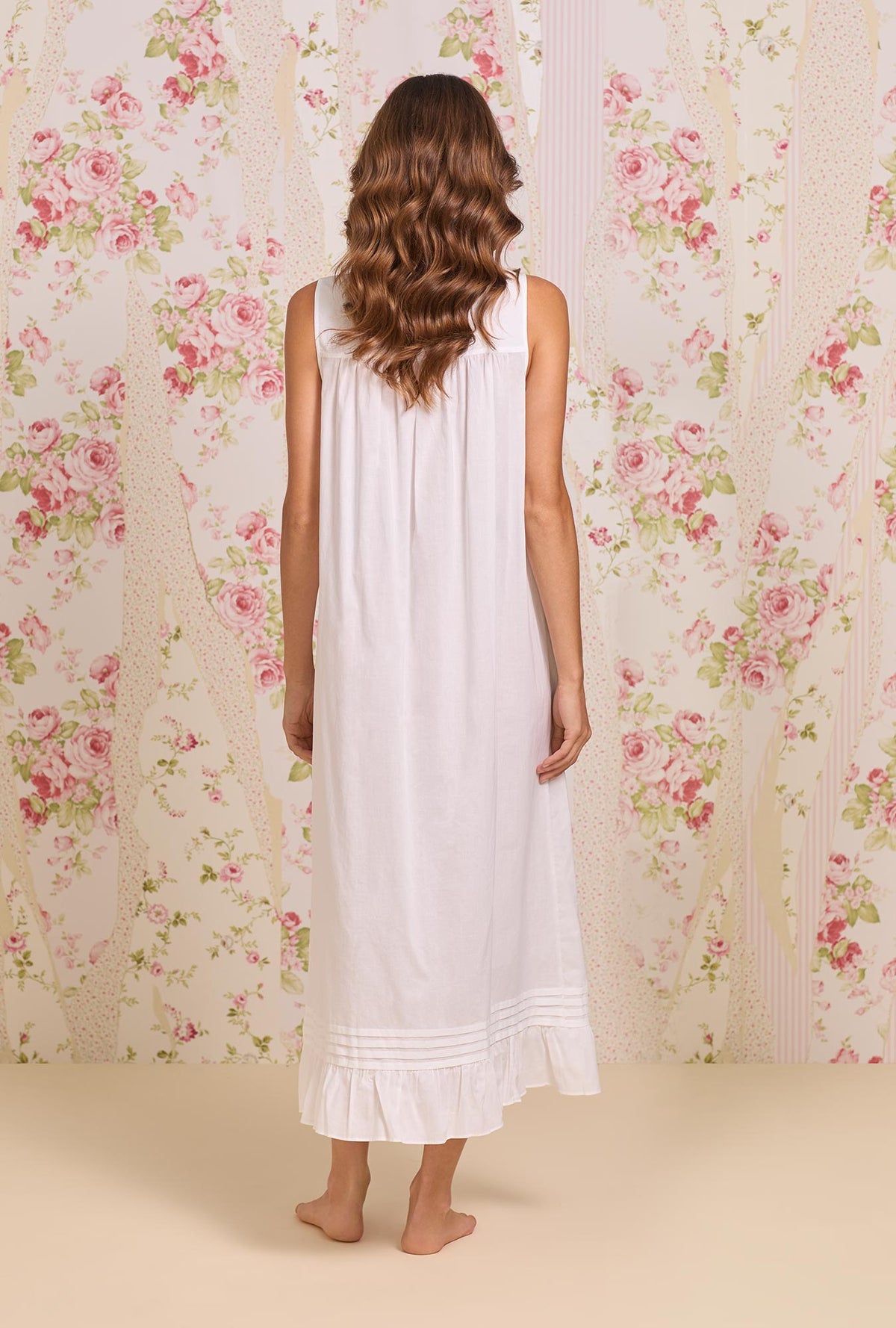 A Lady wearing the "Eileen" Iconic White Cotton Lawn Ballet Nightgown