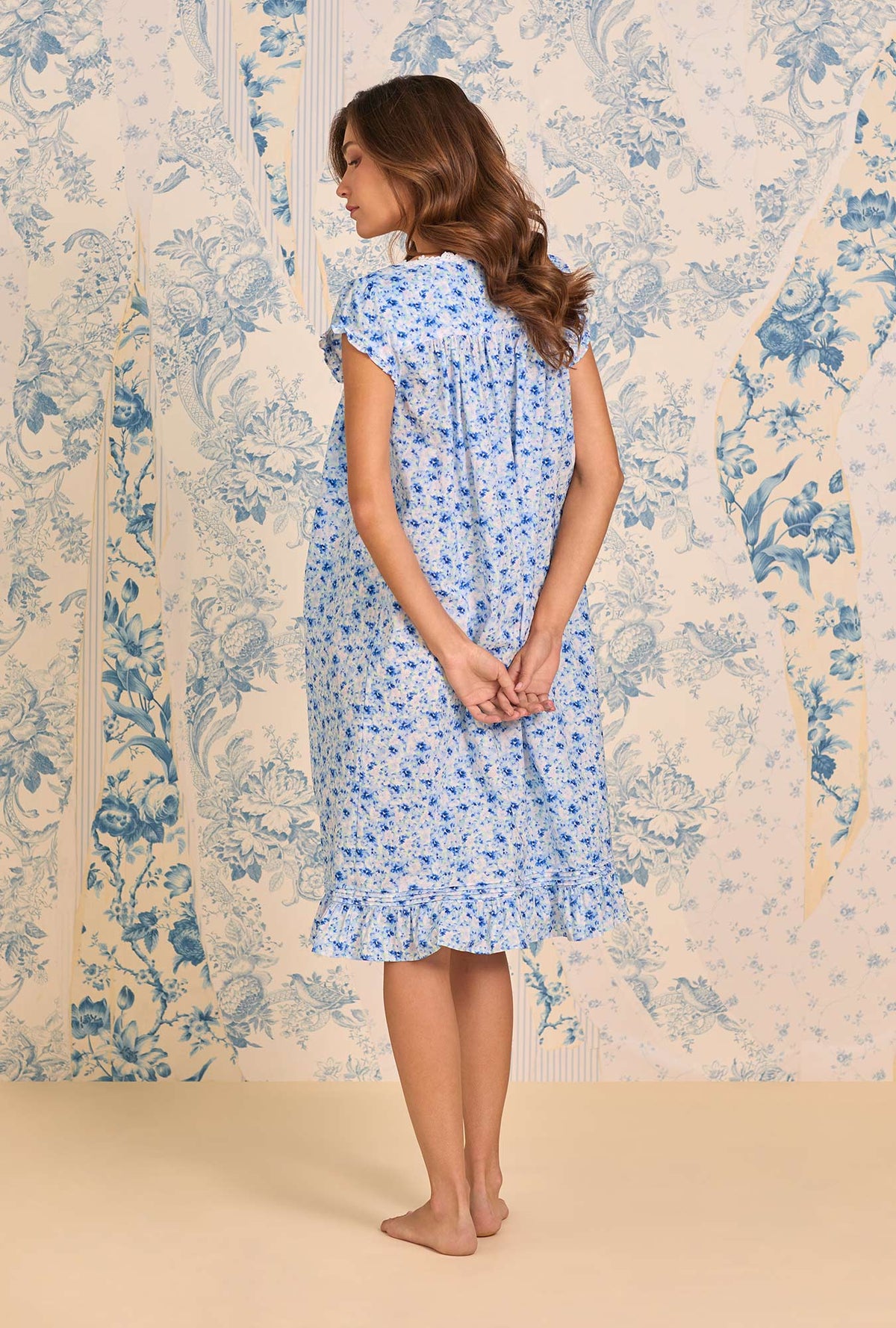 A lady wearing Spring Meadow Cotton Lawn Cap Sleeve Waltz Nightgown back view