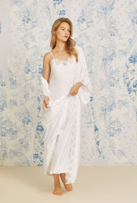 A lady wearing white quarter sleeve satorini satin wrap robe.