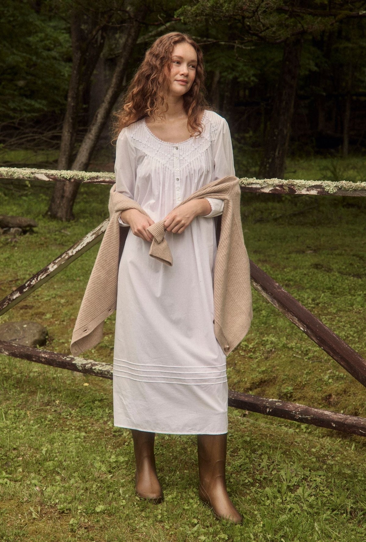 A lady wearing white long sleeve poetic nightgown