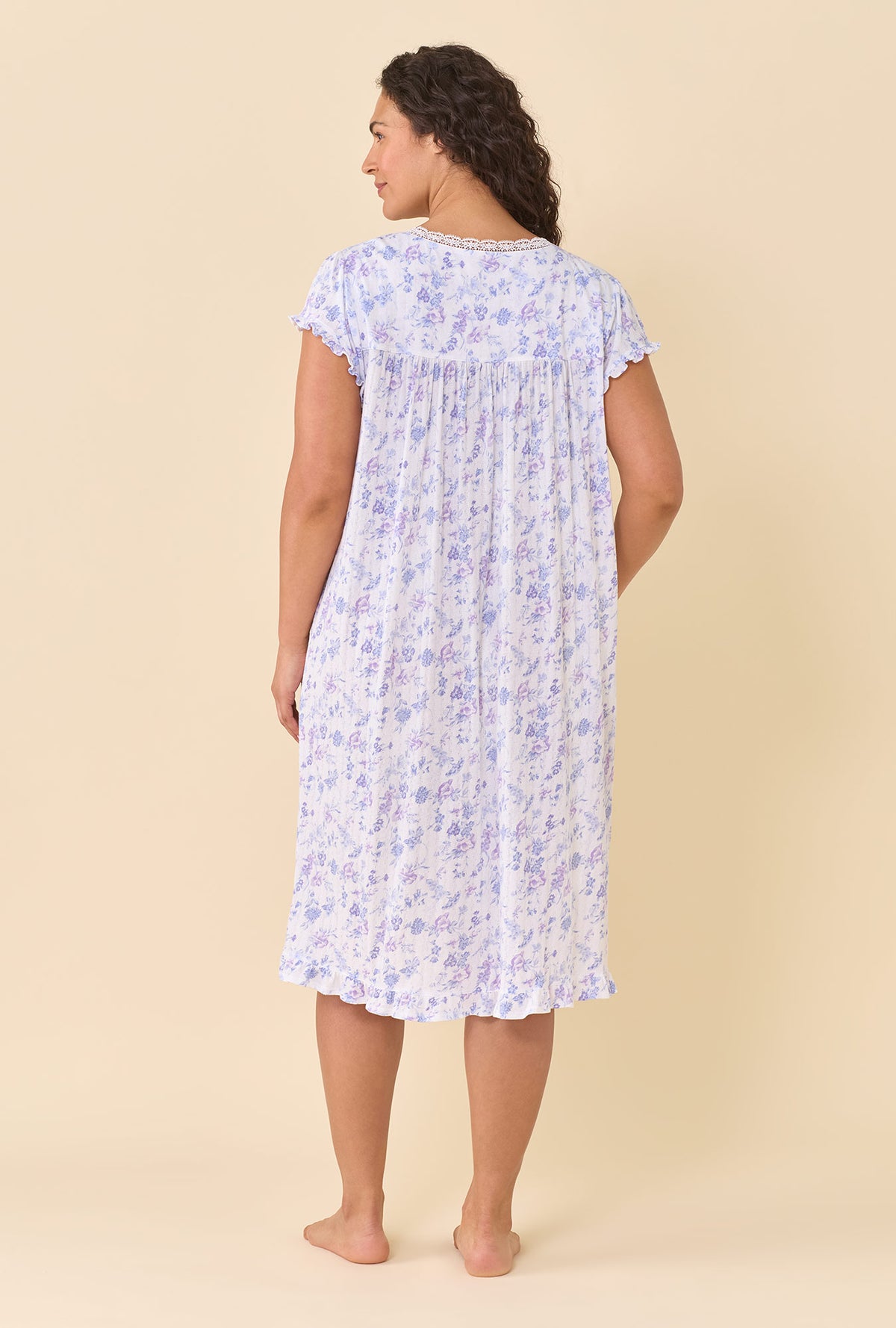 A lady wearing plus size Wildflower Meadow Waltz Nightgown back view