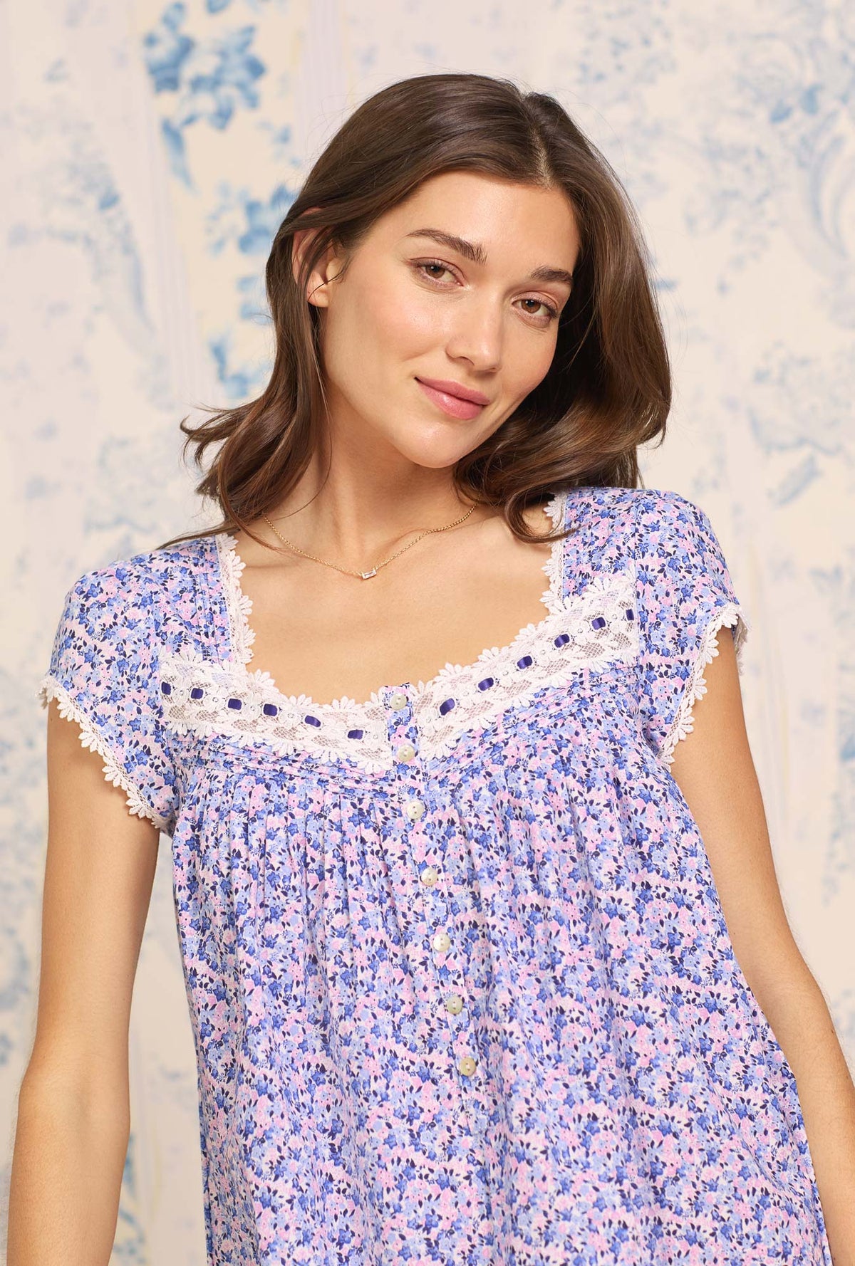 A lady wearing blue sleeveless  Waltz Cotton Nightgown with Joyful Garden print