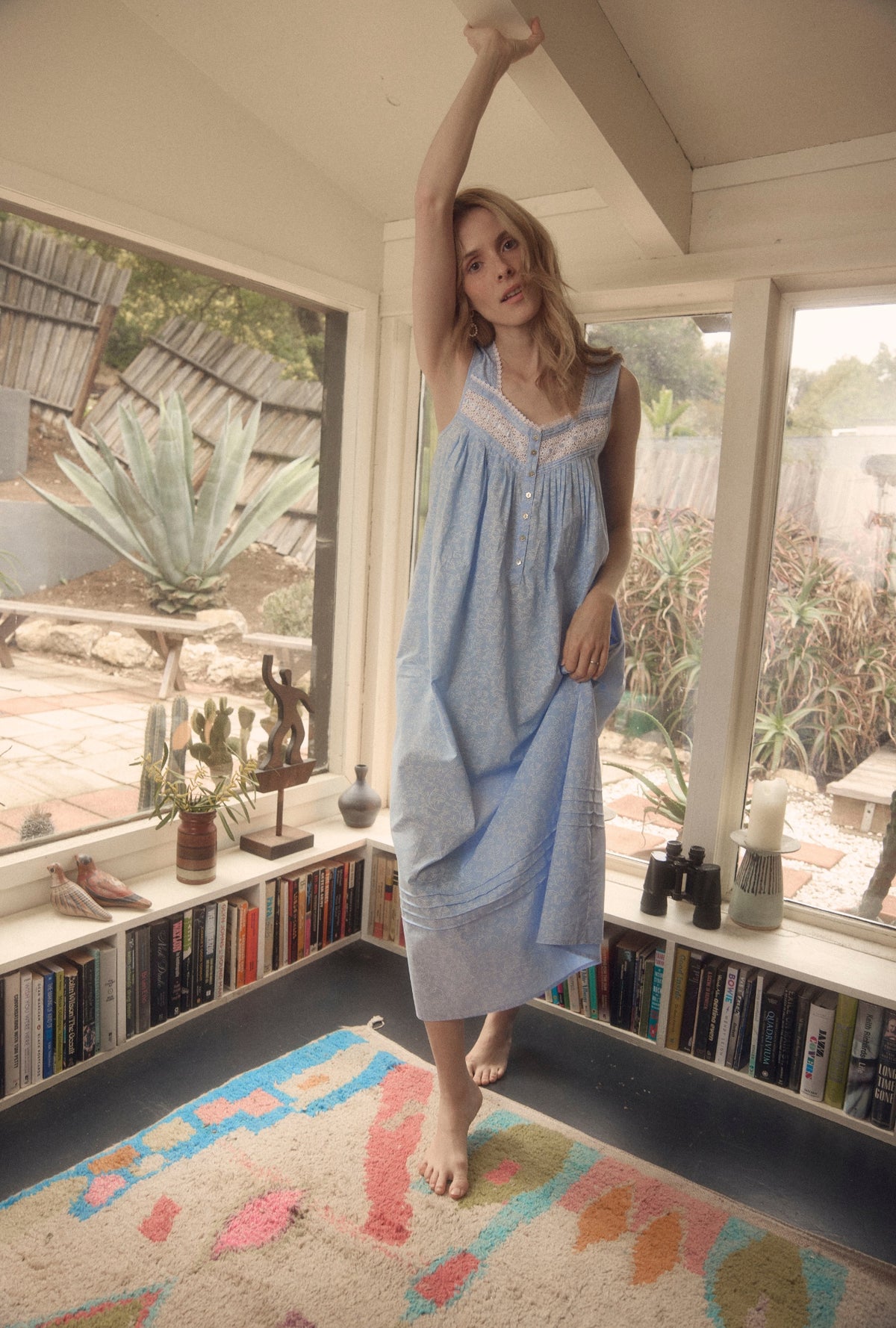 A lady wearing Coastal Willow &quot;Eileen&quot; Cotton Lawn Ballet Nightgown