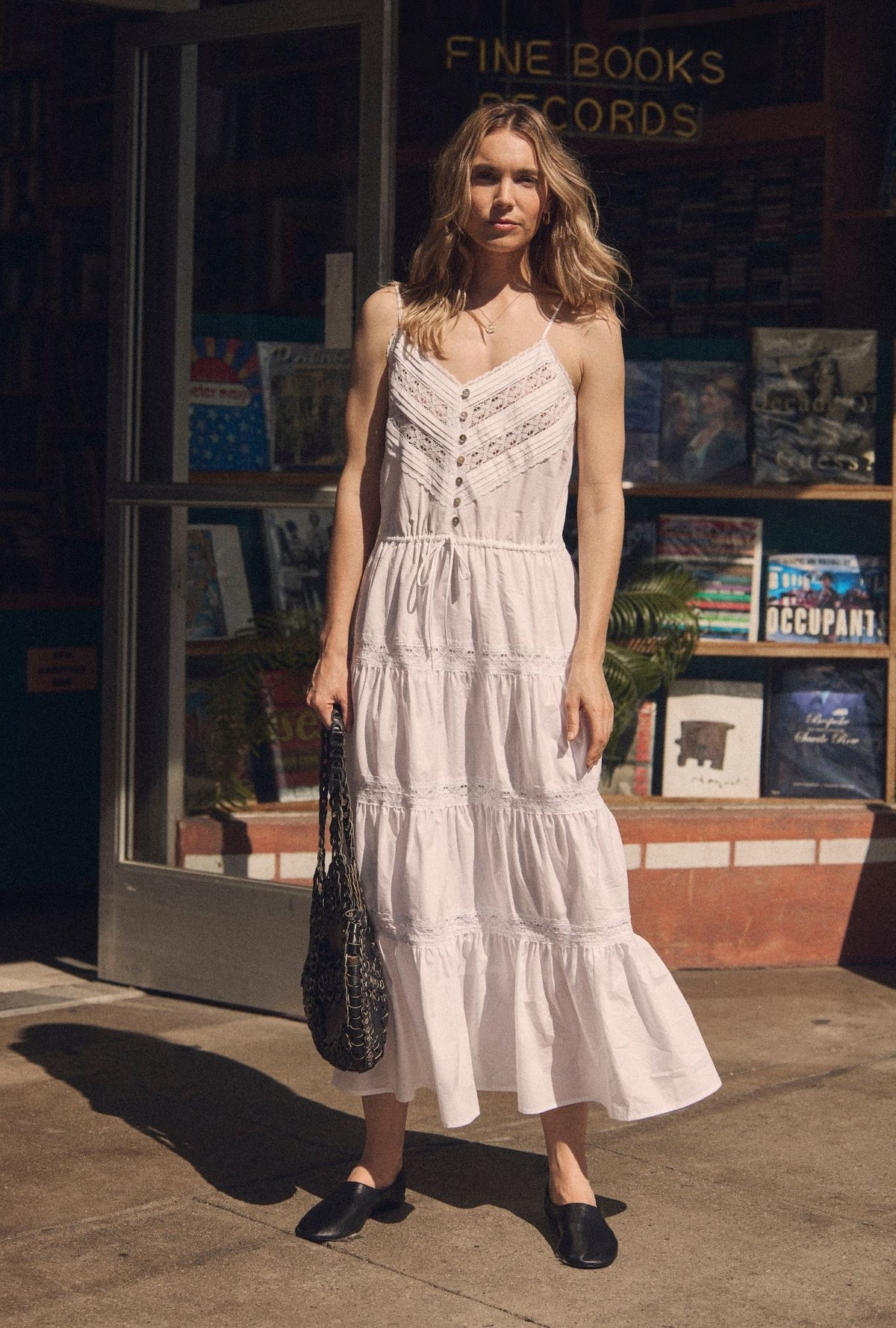 A lady wearing The "Celia" Soft White Cotton Maxi Dress  looking front