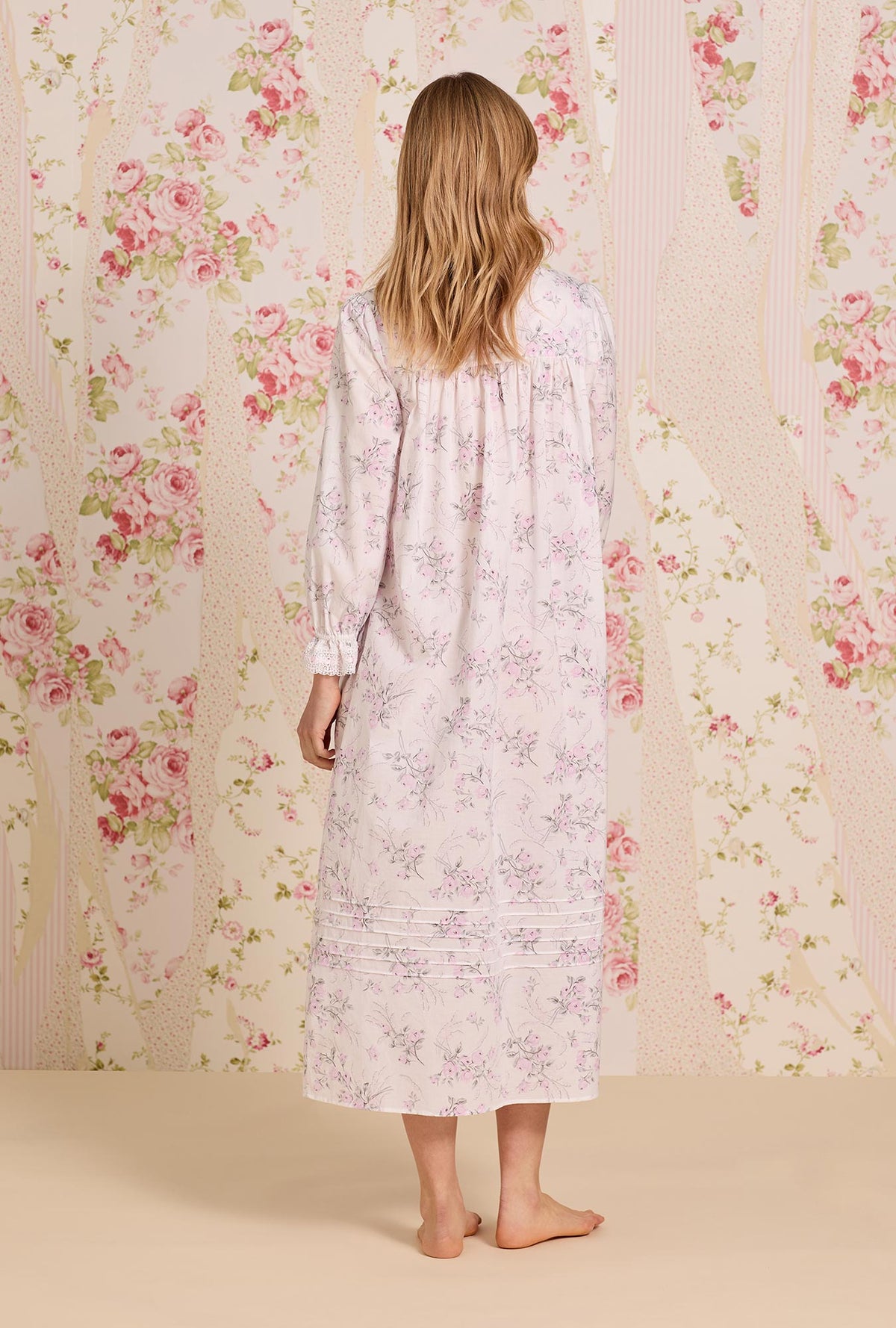 A lady wearing Quiet Bloom Cotton Lawn Long Sleeve Ballet Nightgown