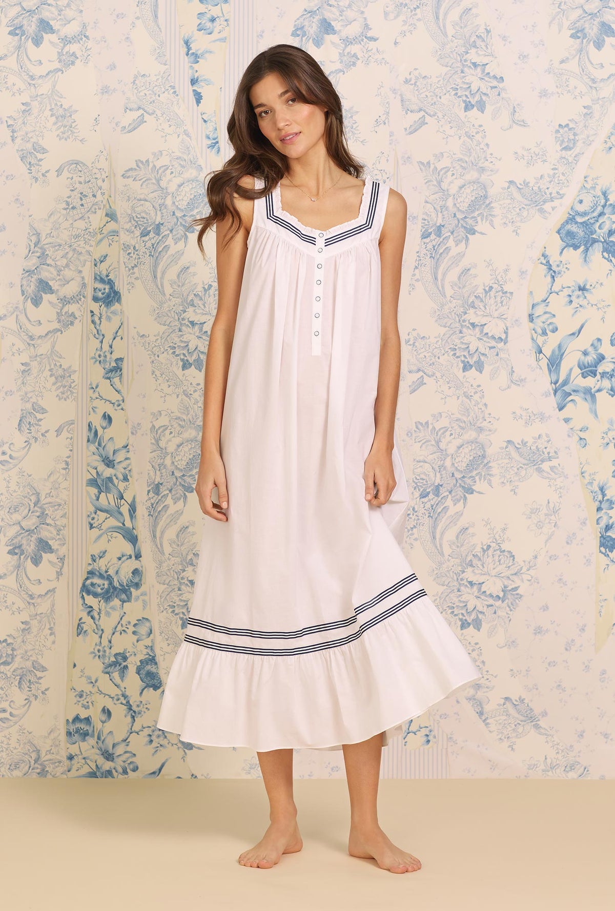 A lady wearing white sleeveless Cotton Nightgown with Nautical Ribbons print