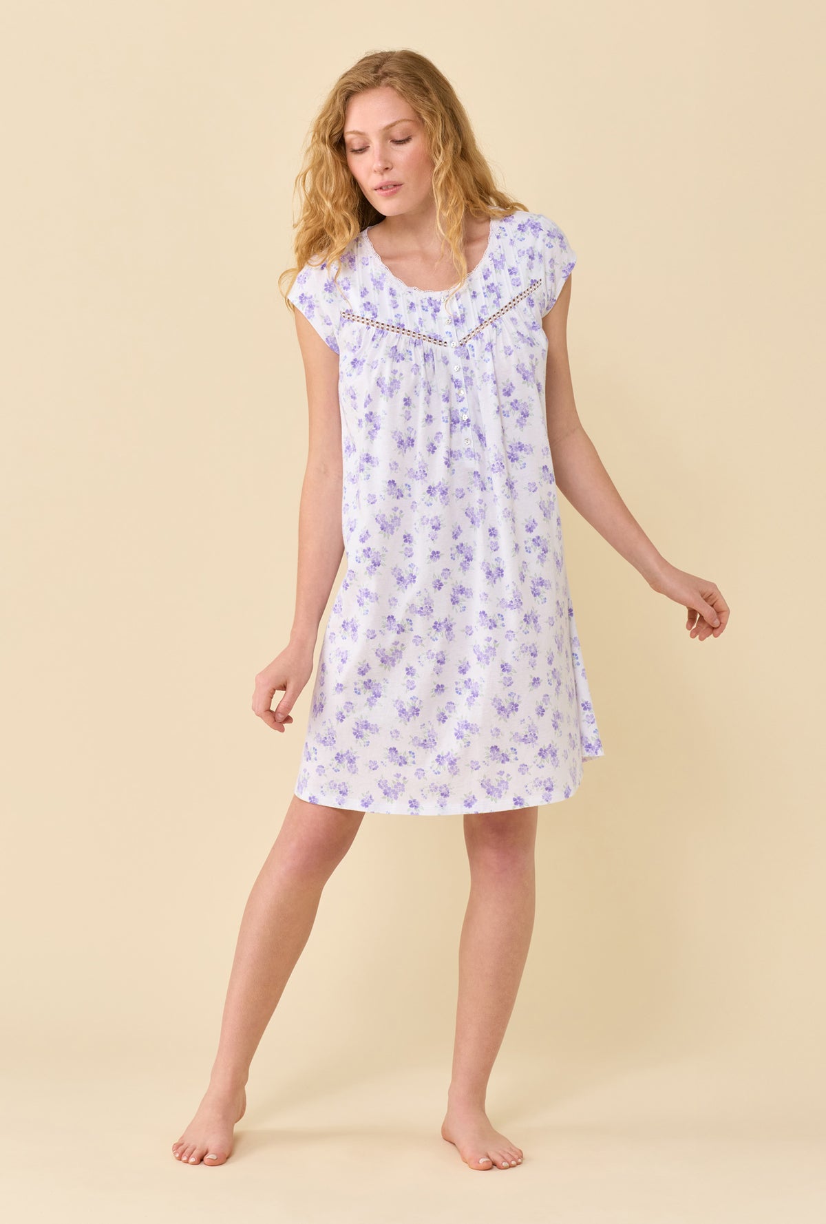 A Lady Wearing Garden Blossom Chemise in a front facing pose looking down