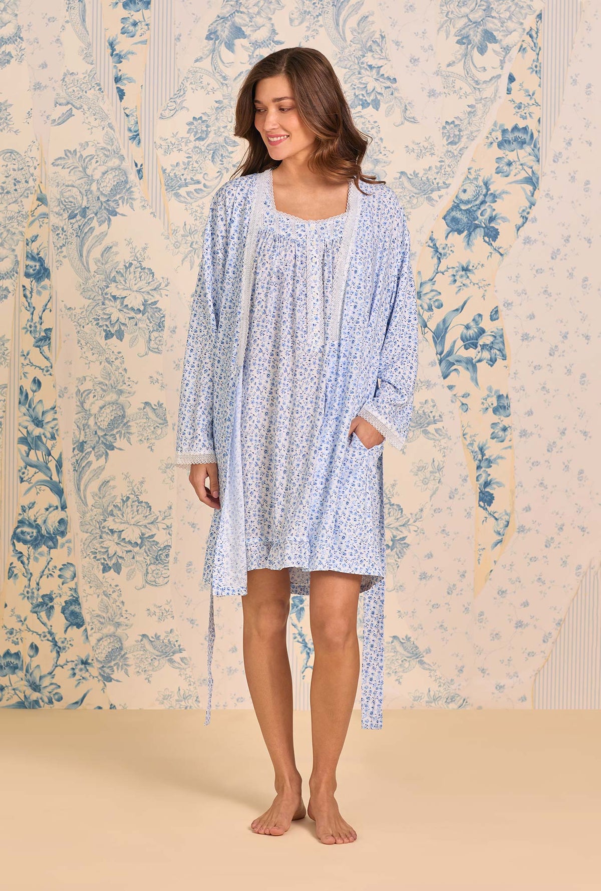 A lady wearing Coastal Sprig Ecovero™ Rayon Short Wrape Robe looking side