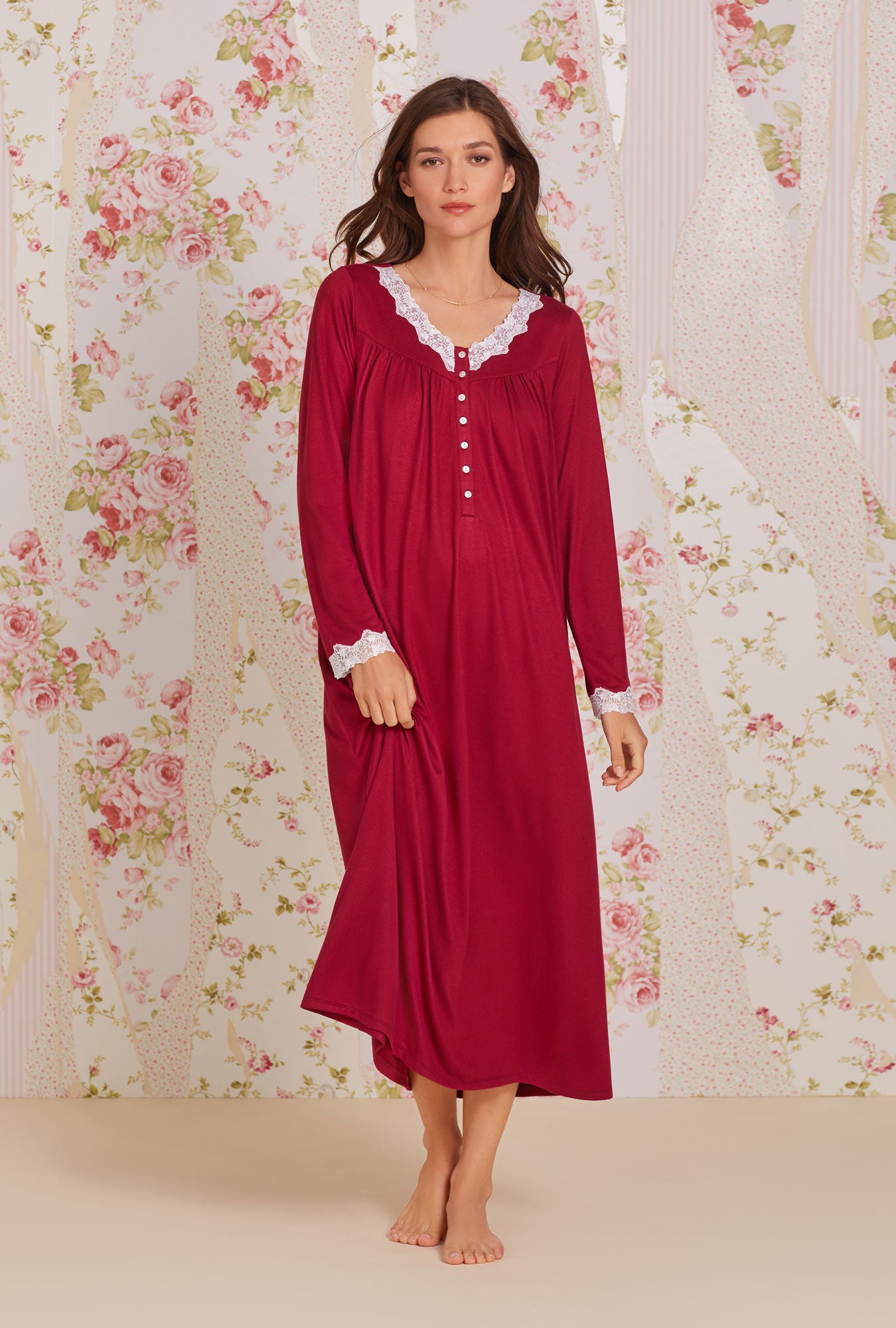 A lady wearing claret long sleeve dreamy sweater knit nightgown. 