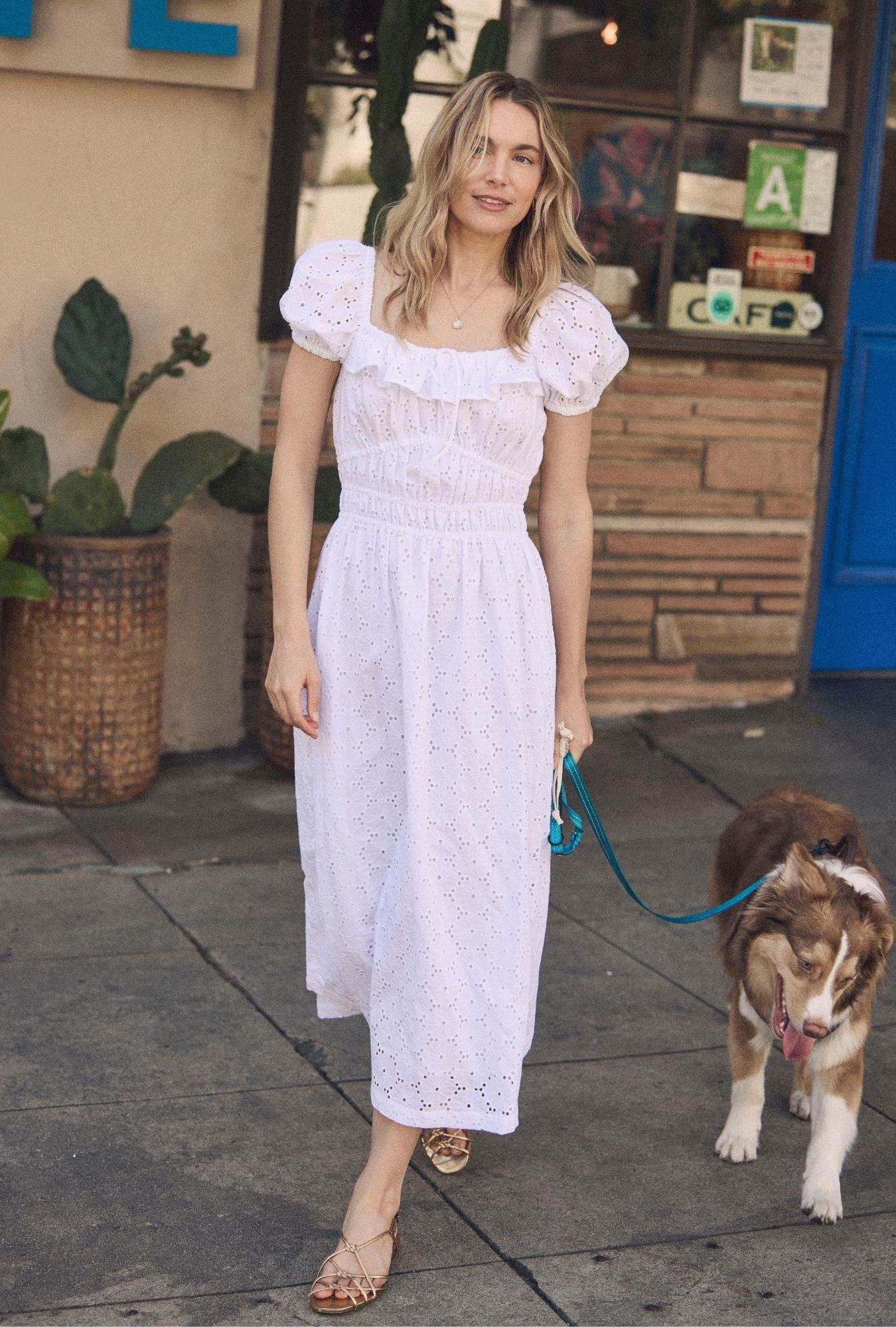 A lady wearing The "Catalina" Soft White Cotton Maxi Dress 