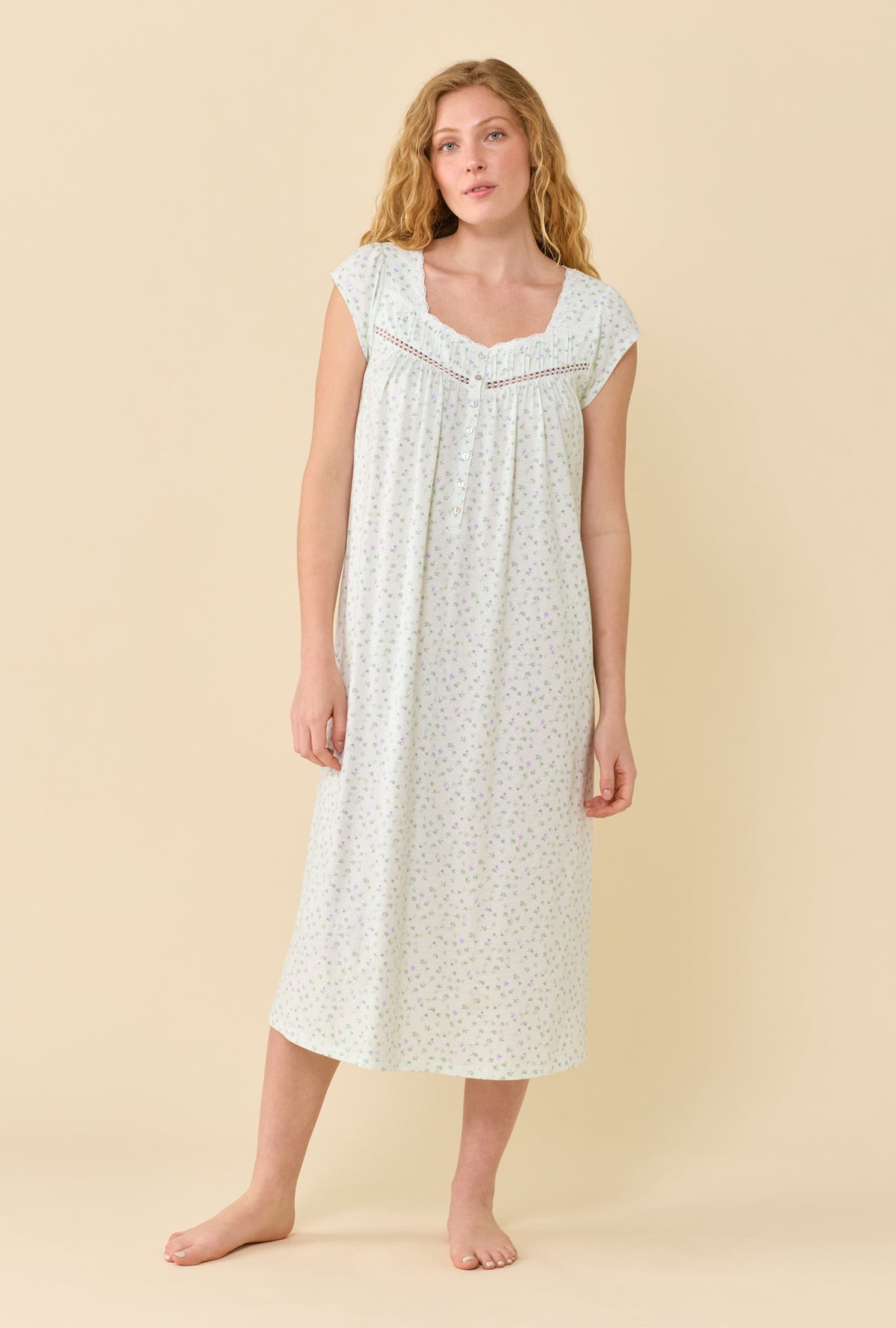 A Lady Wearing Sage Posy Nightgown in a front facing free style pose