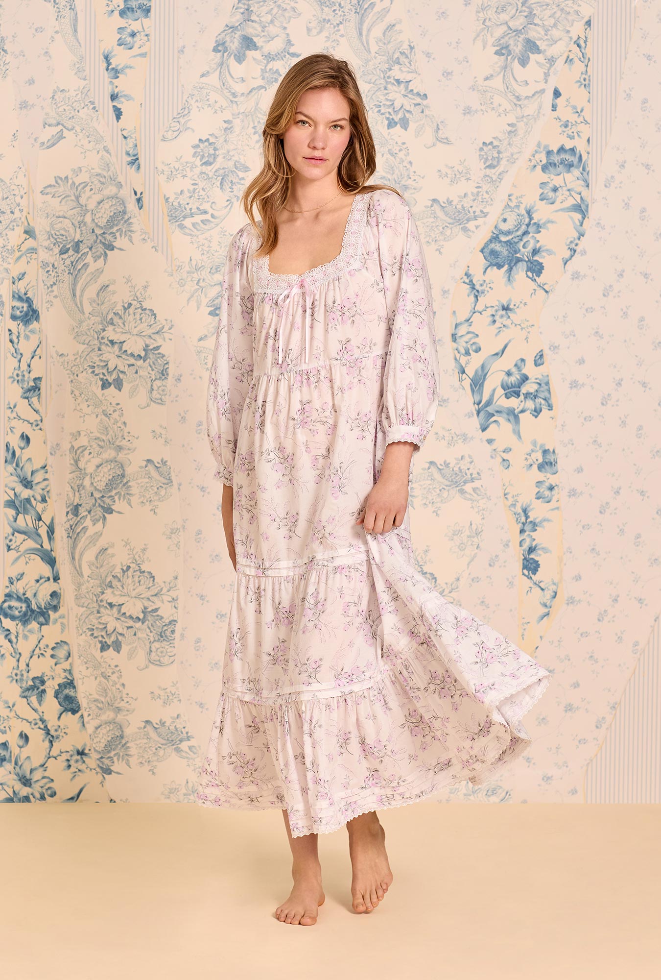 A lady wearing The "Odette" Iconic White Cotton Lawn Ballet Nightgown