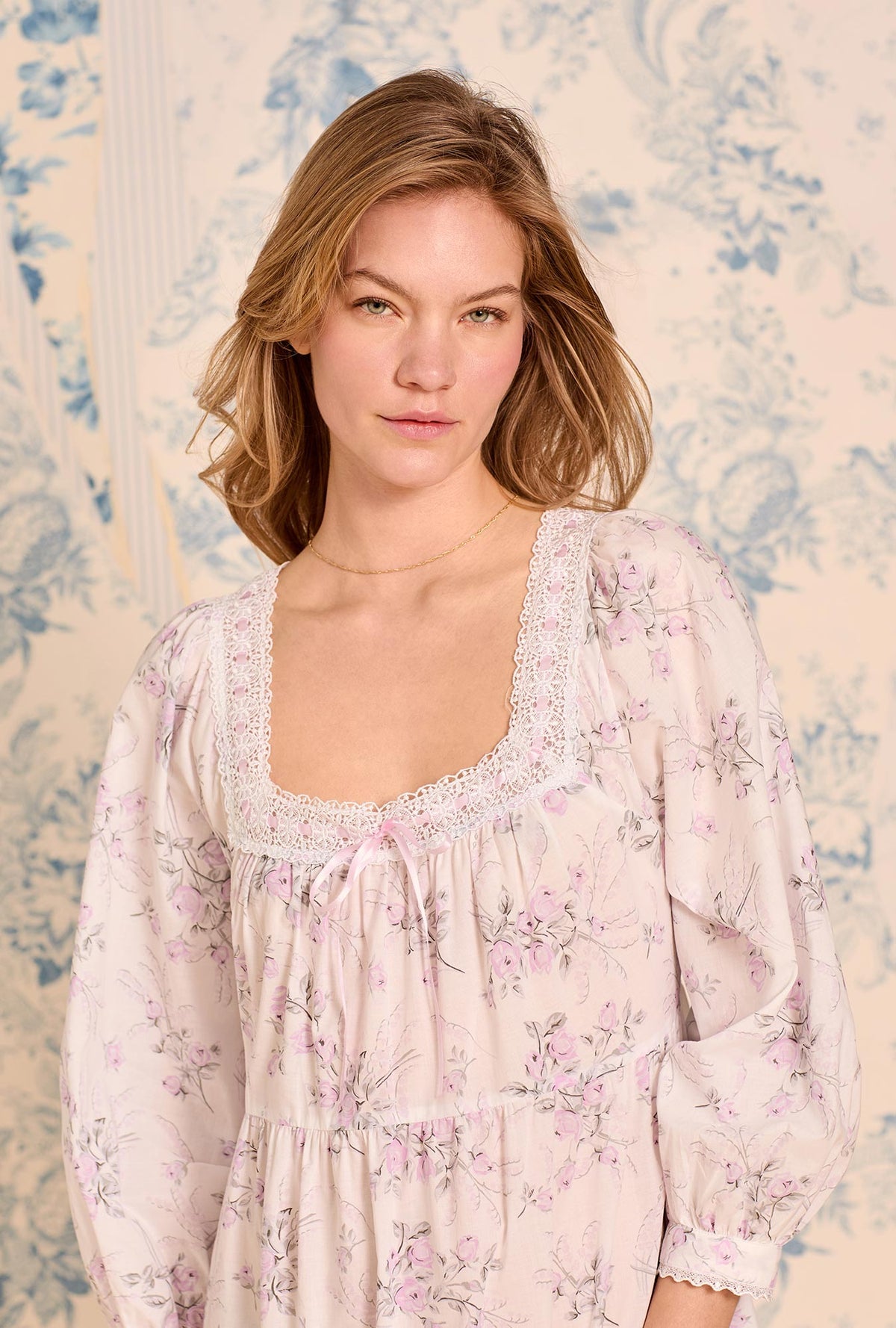 A lady wearing The &quot;Odette&quot; Iconic White Cotton Lawn Ballet Nightgown