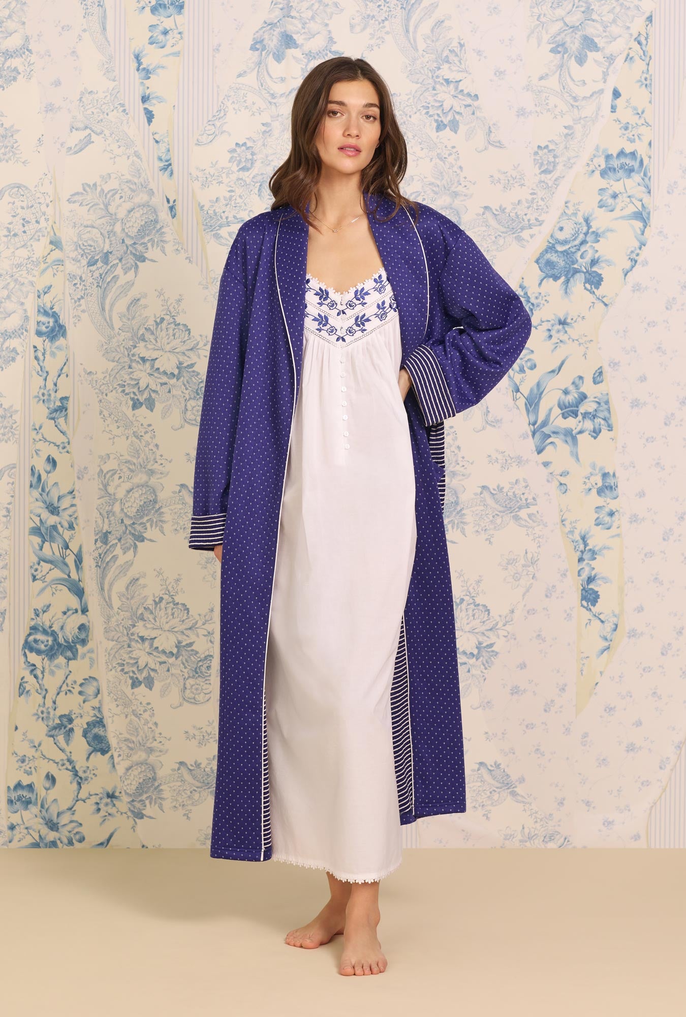 A lady wearing blue Long Sleeve Navy Classic Diamond Quilted Wrap Robe