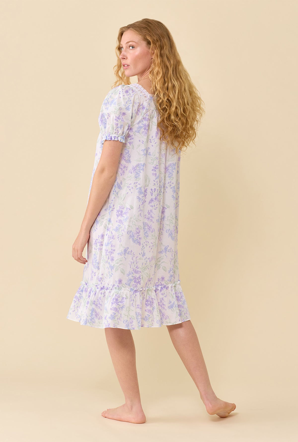 A lady wearing Blooming Arbor Nightgown back view