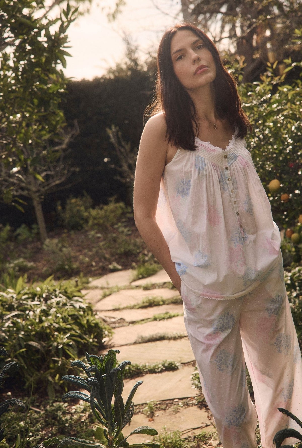 A lady wearing Hydrangea Blossom Cotton Lawn Capri Pajama looking front in the garden