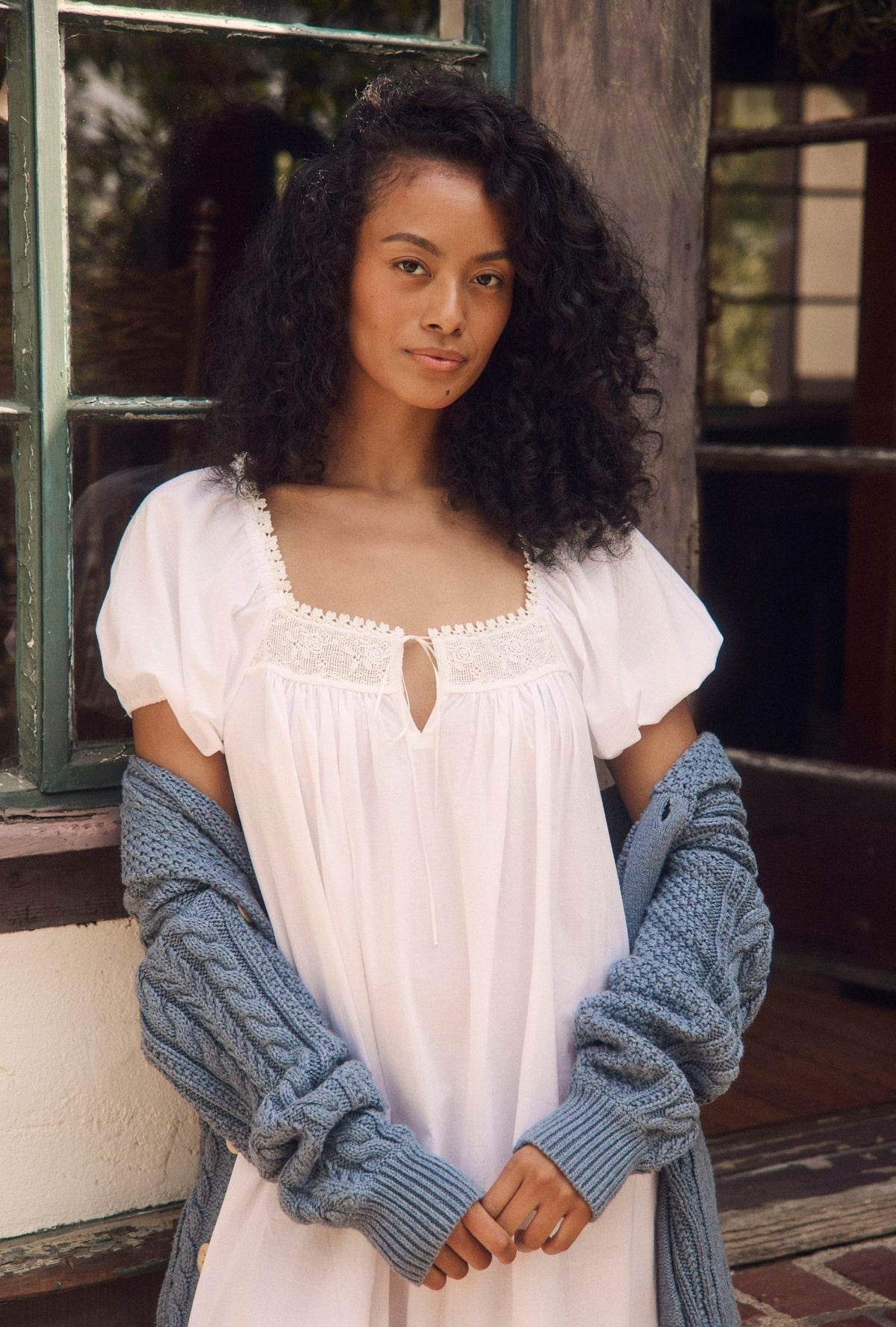 A lady wearing the "Jolee" Iconic White Cotton Lawn Ballet Nightgown