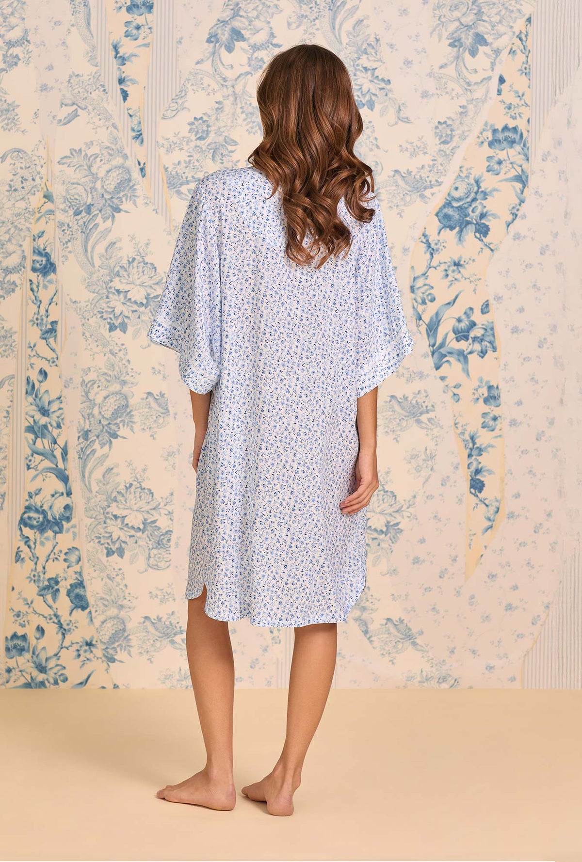 A lady wearing Coastal Sprig Ecovero™ Rayon Caftan back view