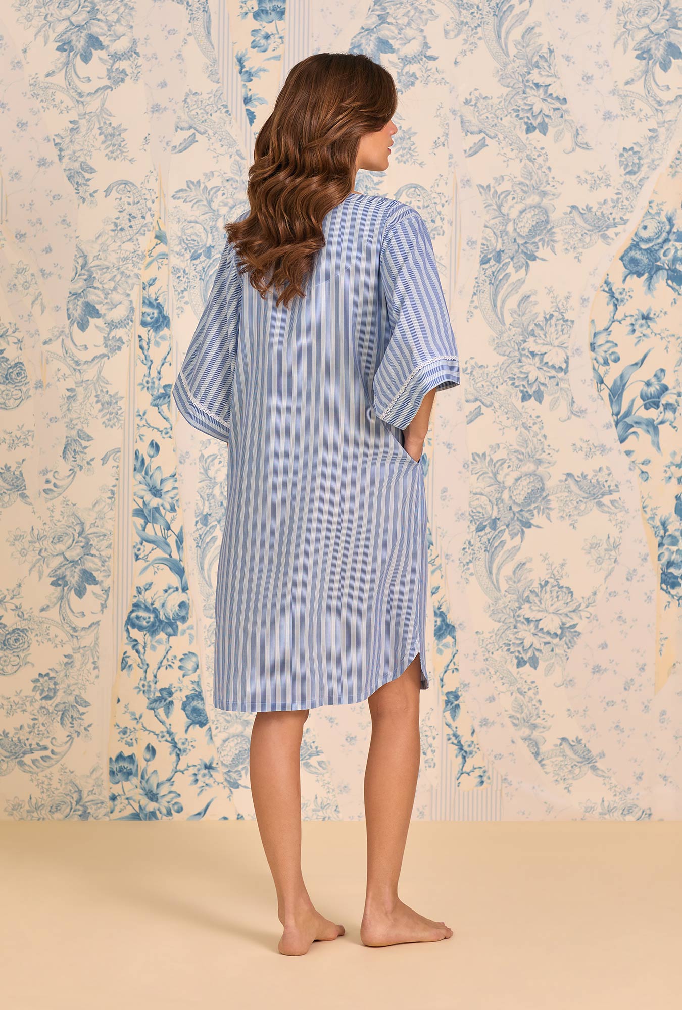 A lady weraring Harbour Stripe Ecovero™ Rayon Caftan sitting outside