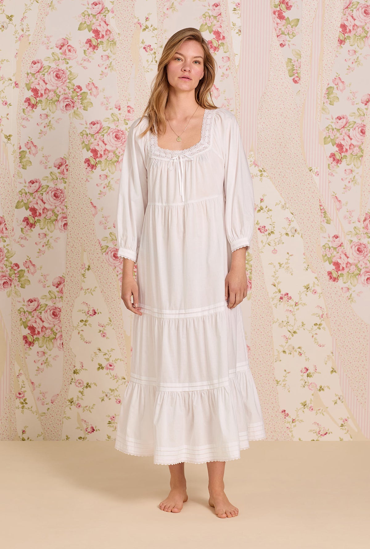 A lady wearing The &quot;Odette&quot; Iconic White Cotton Lawn Ballet Nightgown