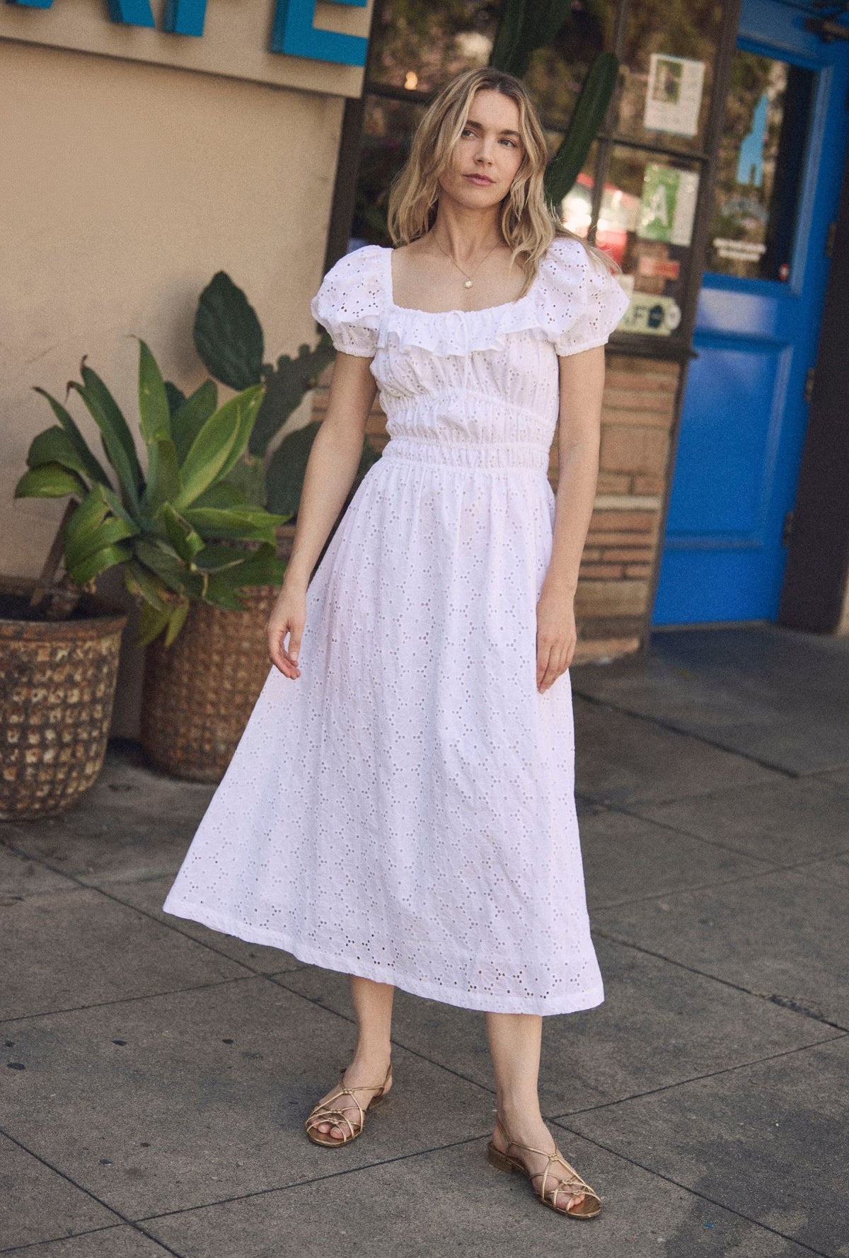 A lady wearing The "Catalina" Soft White Cotton Maxi Dress looking front
