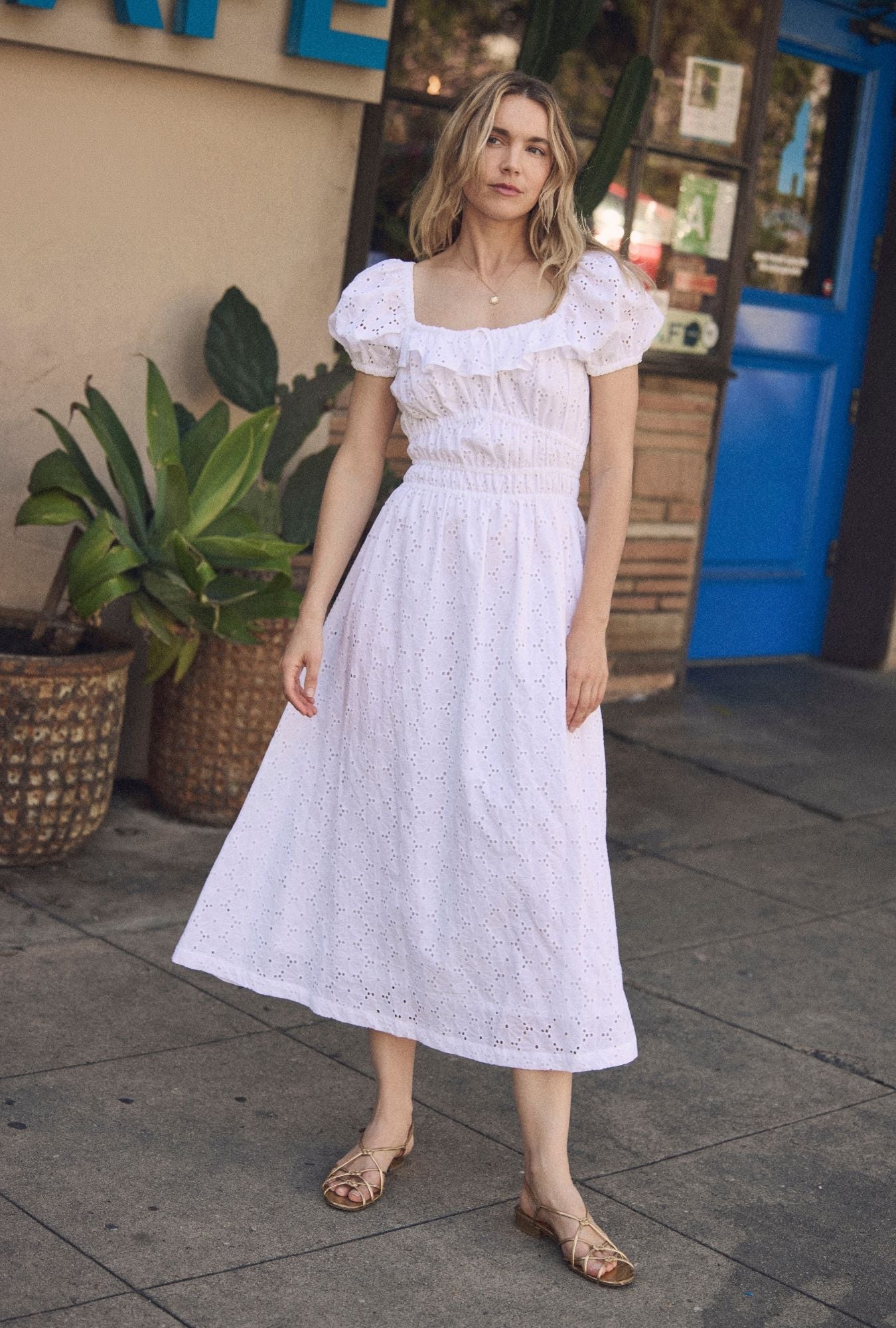 A lady wearing The "Catalina" Soft White Cotton Maxi Dress looking front