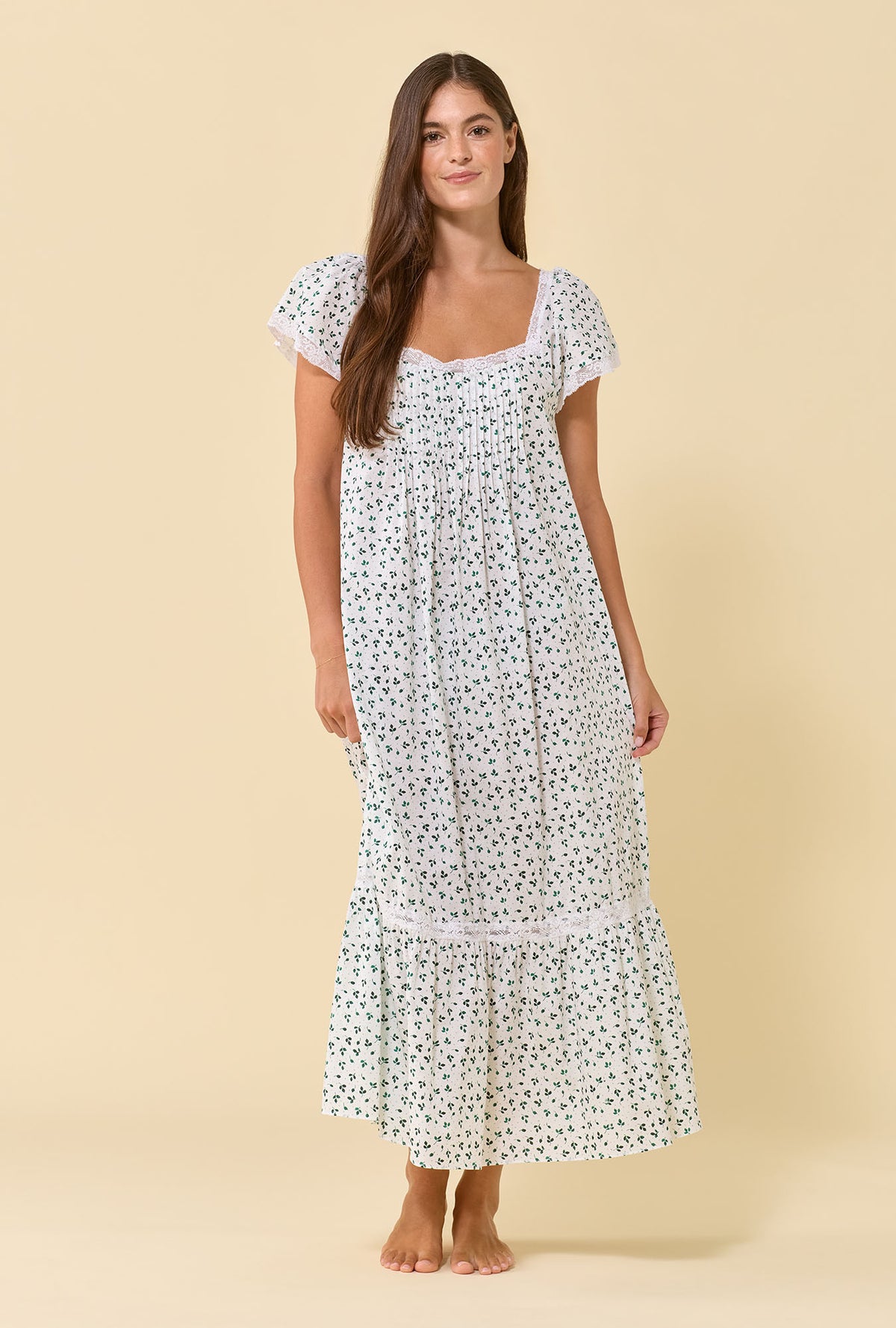 A lady wearing Grace Meadow Sage 100% Cotton Woven Lawn Flutter Sleeve Ballet Nightgown