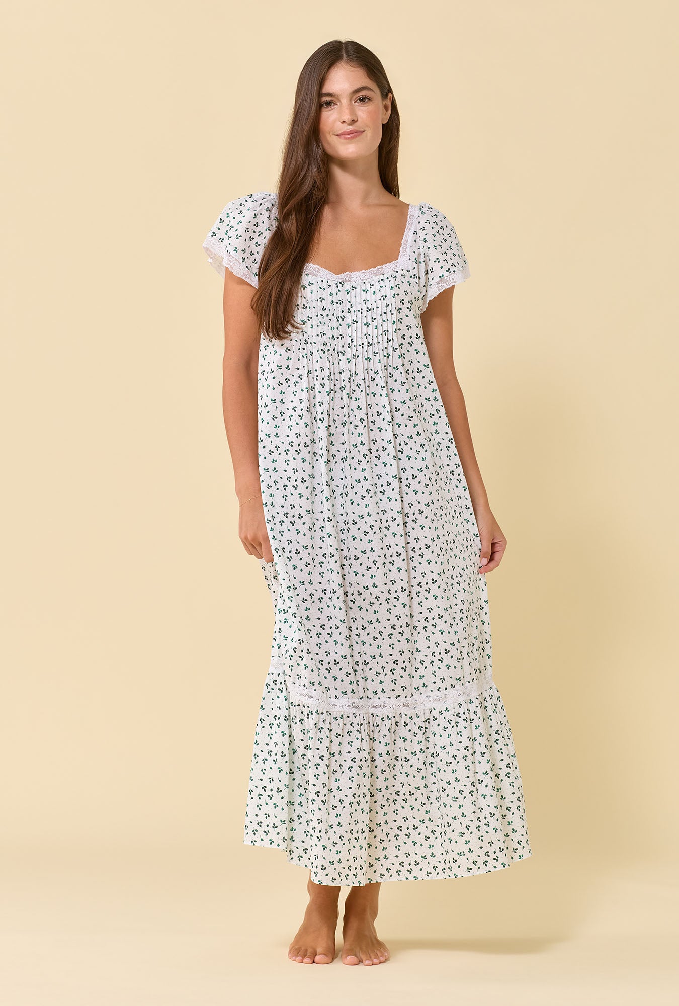 A lady wearing Grace Meadow Sage 100% Cotton Woven Lawn Flutter Sleeve Ballet Nightgown