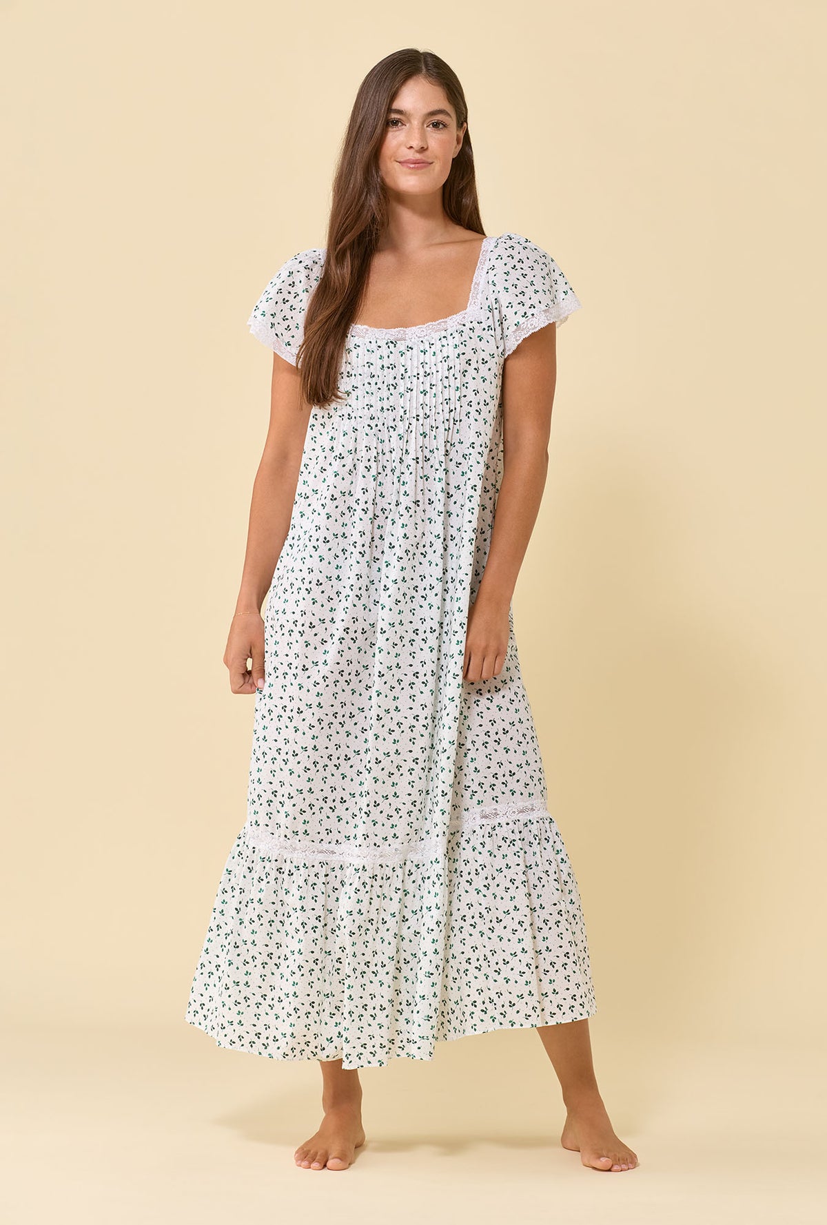 A lady wearing Grace Meadow Sage 100% Cotton Woven Lawn Flutter Sleeve Ballet Nightgown looking front