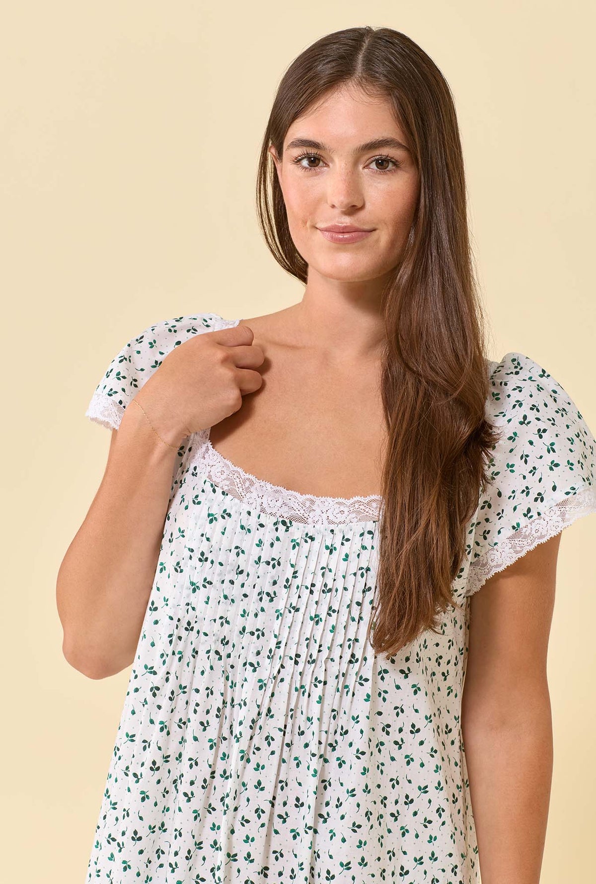 A lady wearing Grace Meadow Sage 100% Cotton Woven Lawn Flutter Sleeve Ballet Nightgown closer look