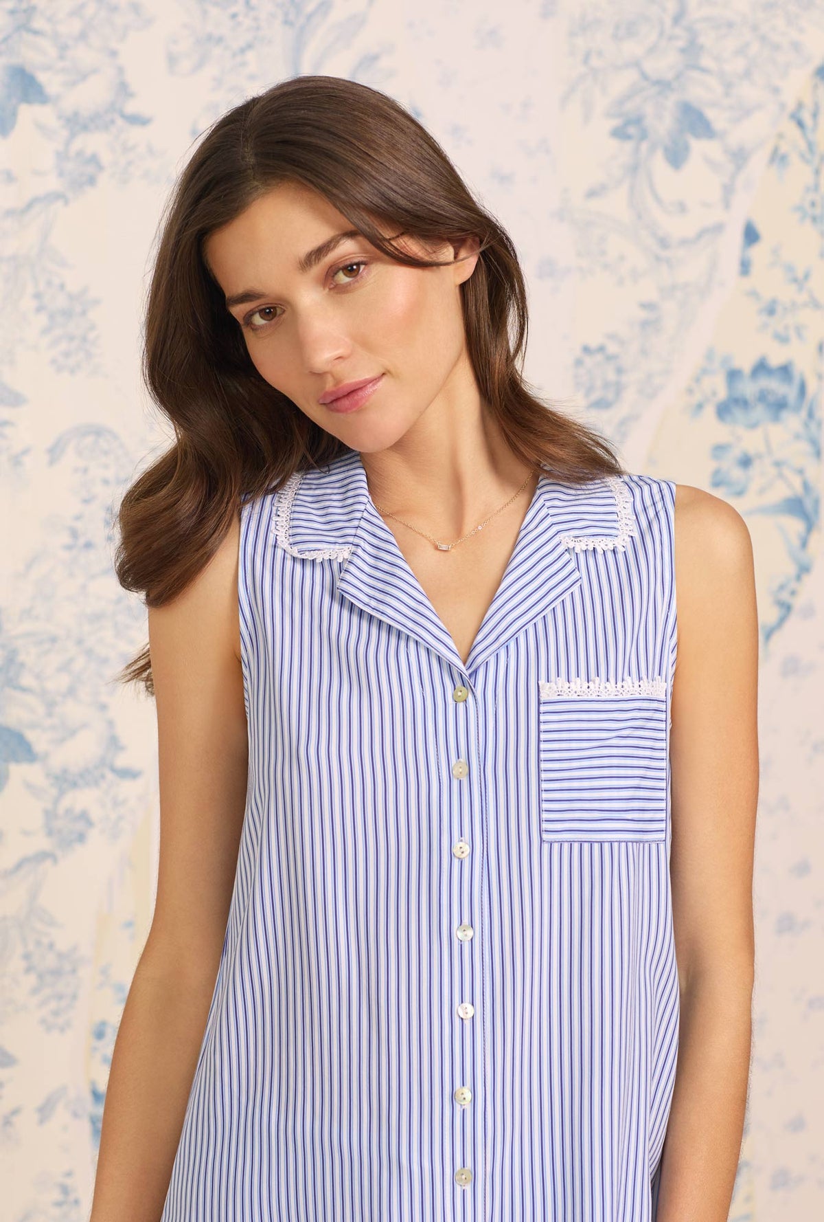A lady wearing blue sleeveless Navy Stripe Classic Capri PJ Set with Ecovero print