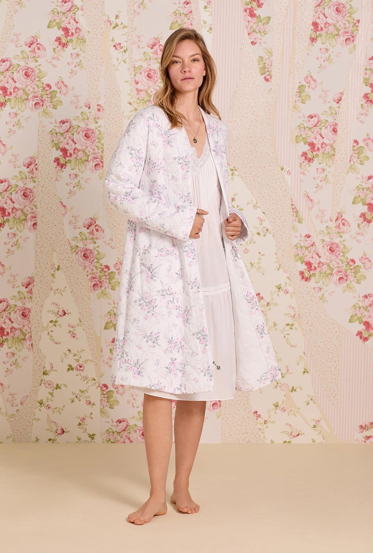 A lady wearing Quiet Bloom Cotton Diamond Quilt Zip Robe