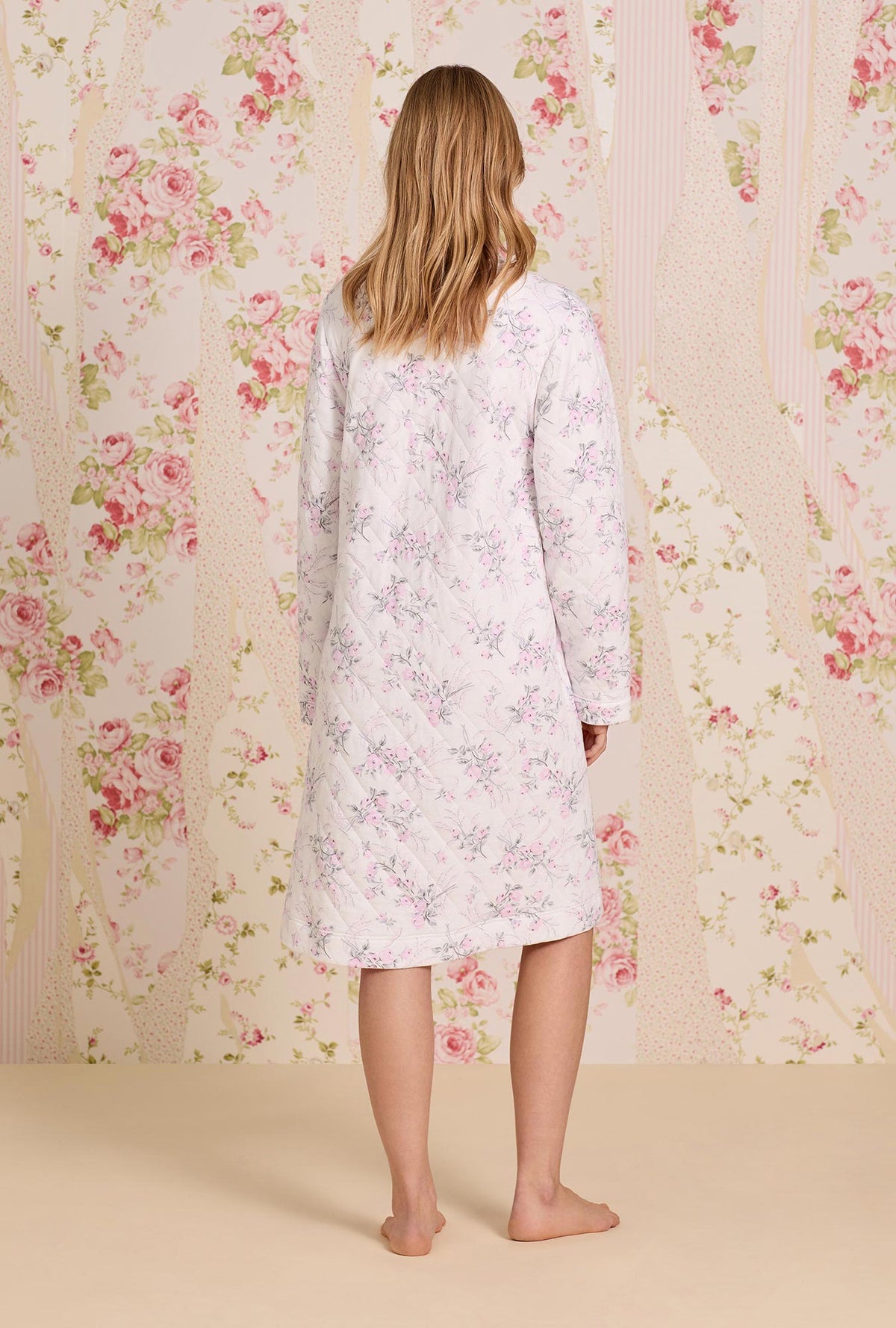 A lady wearing Quiet Bloom Cotton Diamond Quilt Zip Robe