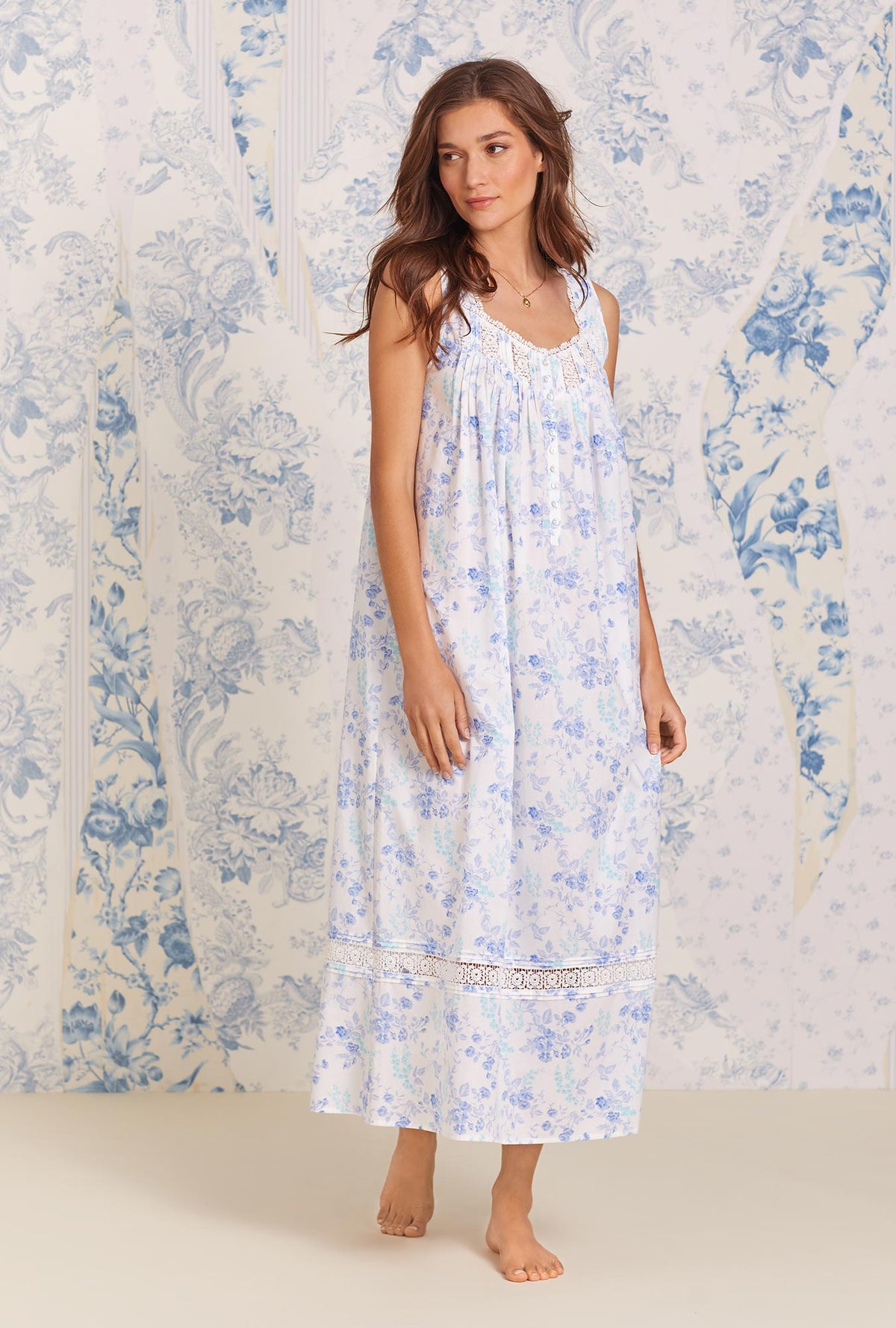 A lady wearing blue sleeveless Nightgown with Moonflower print