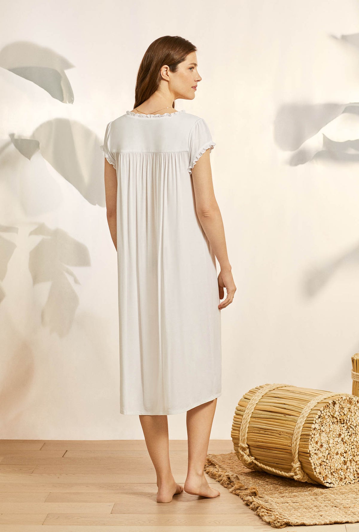 A lady wearing white cap sleeve cassic knit waltz nightgown with tencel white dream pattern