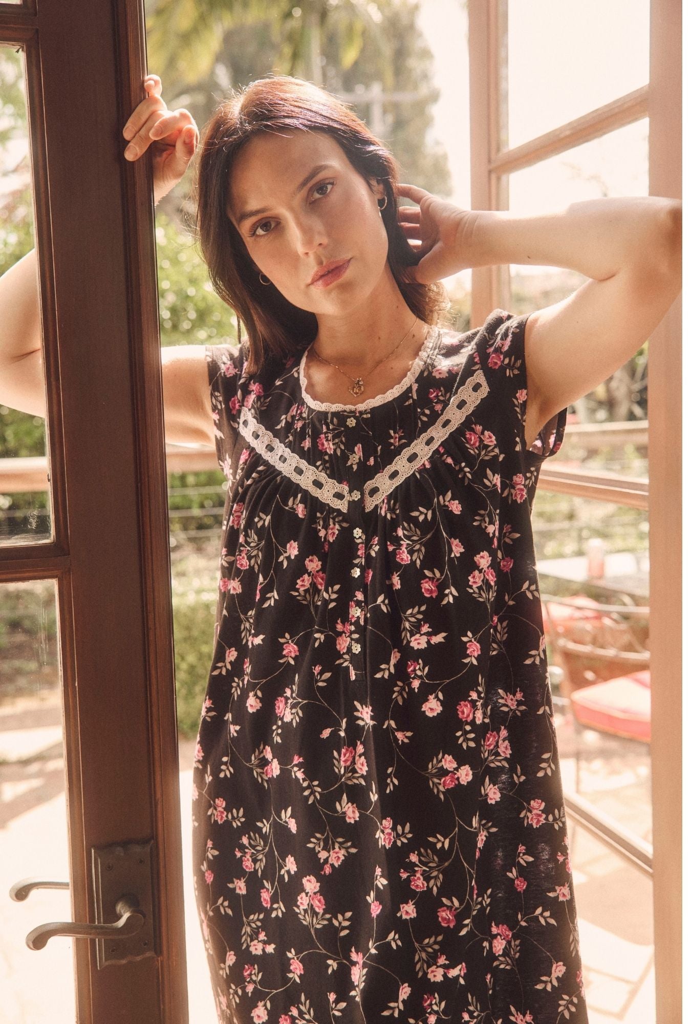 A lady wearing Vintage Vine Cap Sleeve Chemise near window